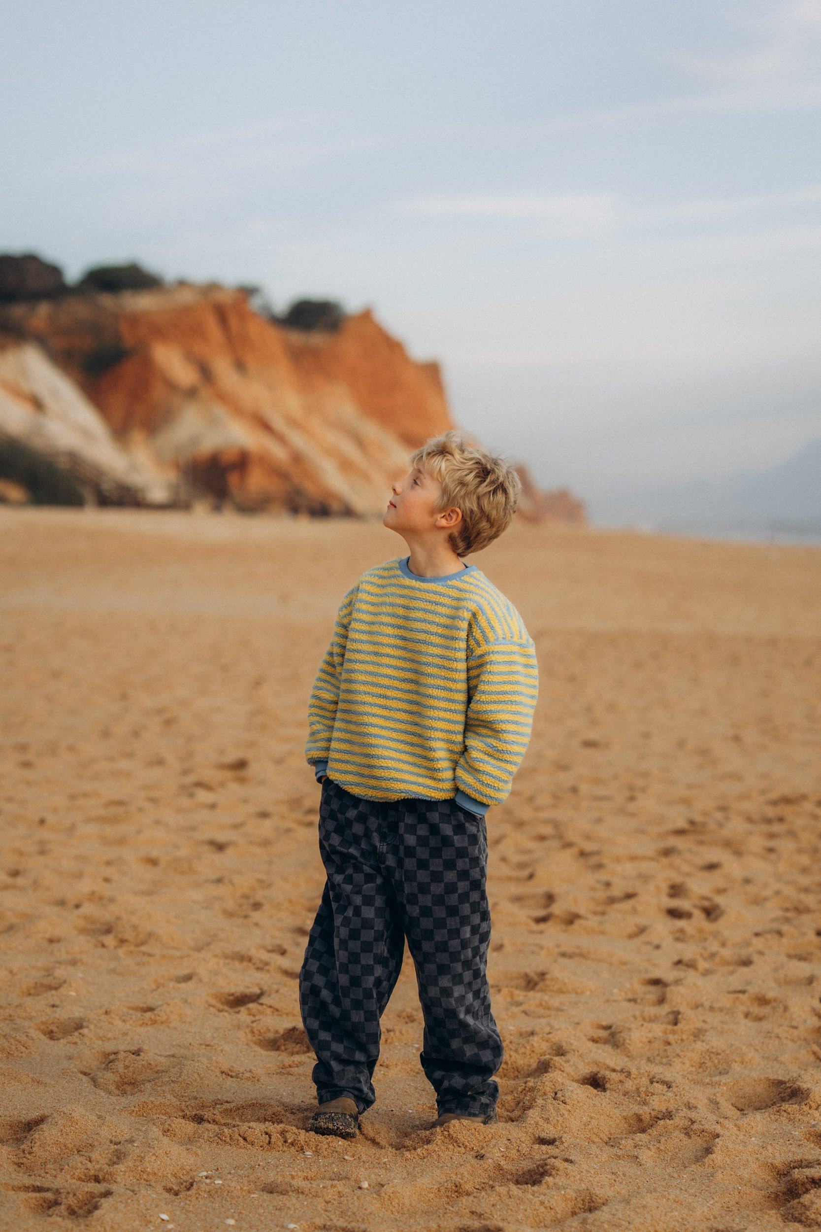 Child portrait during family photoshoot at Falésia beach Algarve Portugal