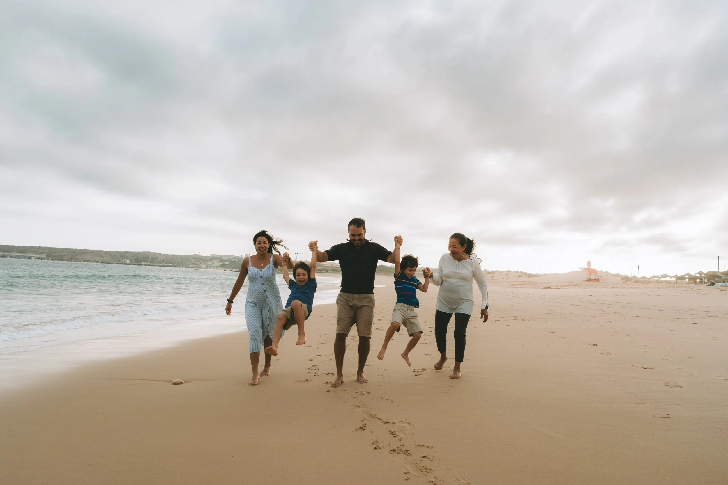 Close family moment with everyone together, focusing on expressions and connection rather than perfect positioning.