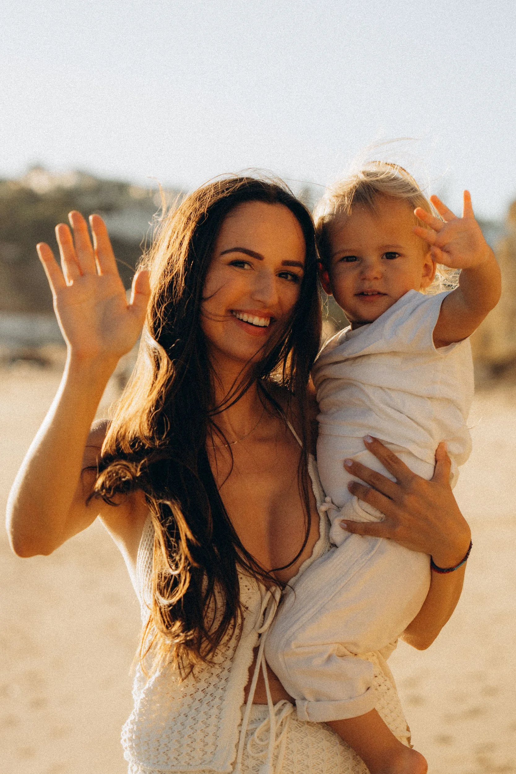 Close portrait of mother holding child during Porto de Mos family photoshoot

