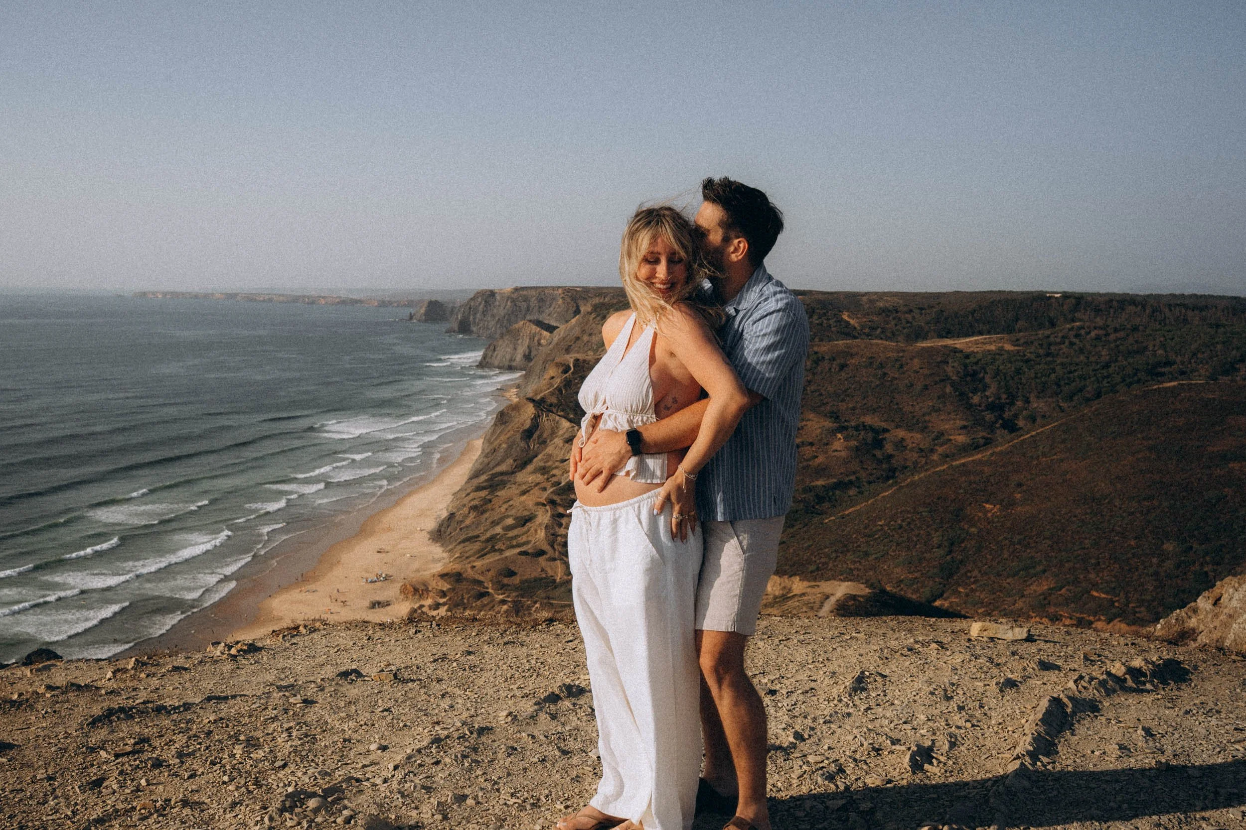 Couple photoshoot on the cliffs above Praia do Castelejo in Sagres, Algarve, capturing natural connection and cinematic coastal scenery in Portugal.