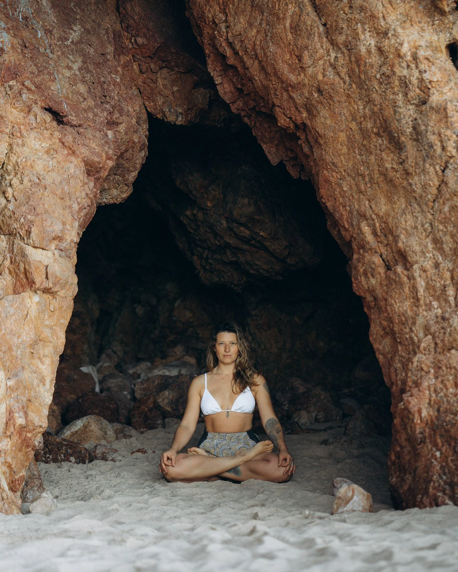 Natural yoga portrait focused on breath, balance, and connection with the coastal landscape.