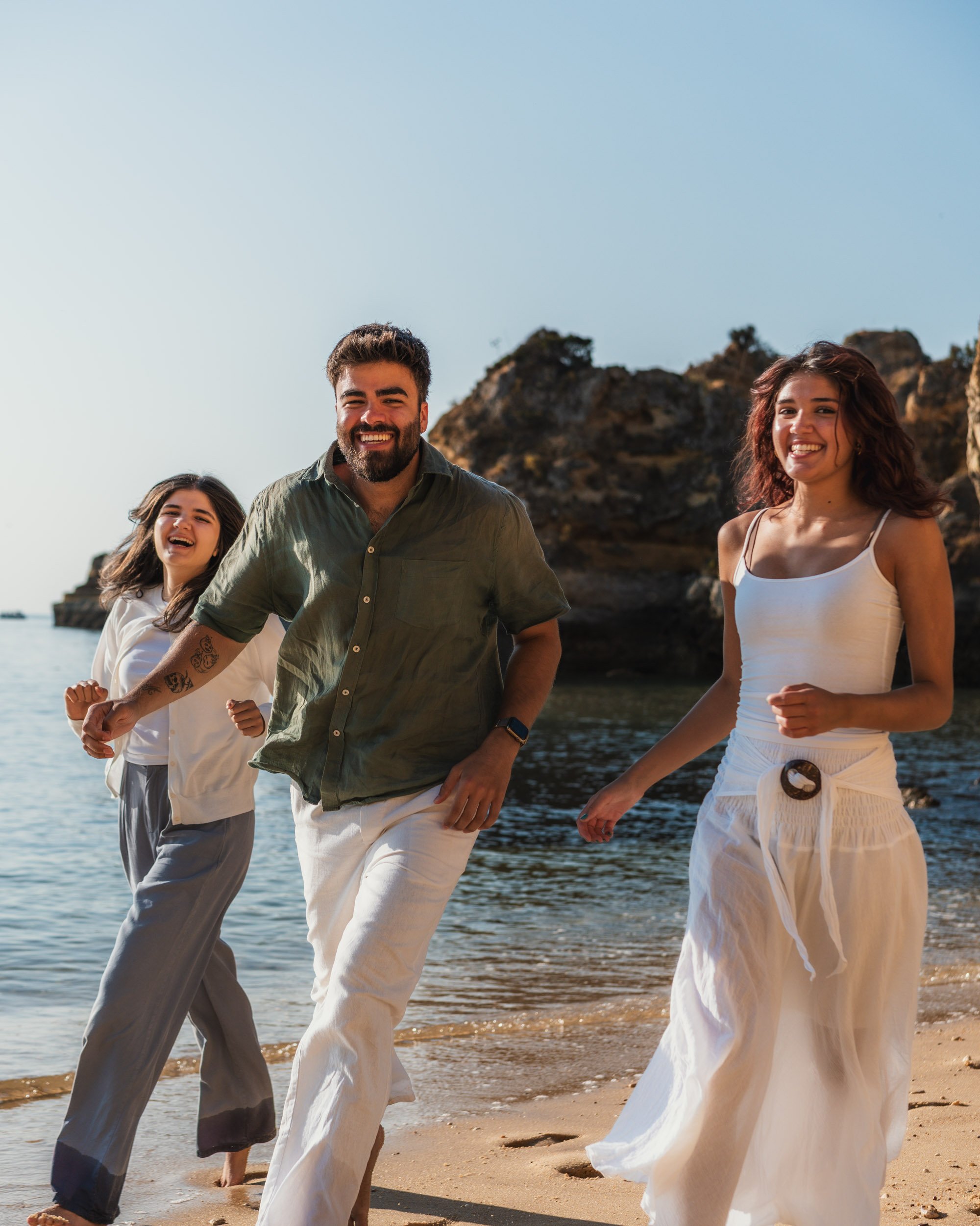 Candid family moment at Praia do Camilo beach in Lagos, Algarve.