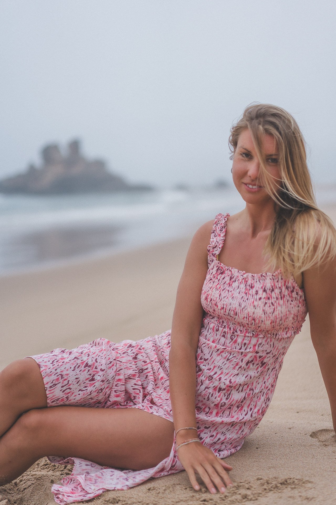 Natural portraits framed by wide sand and powerful coastline.
