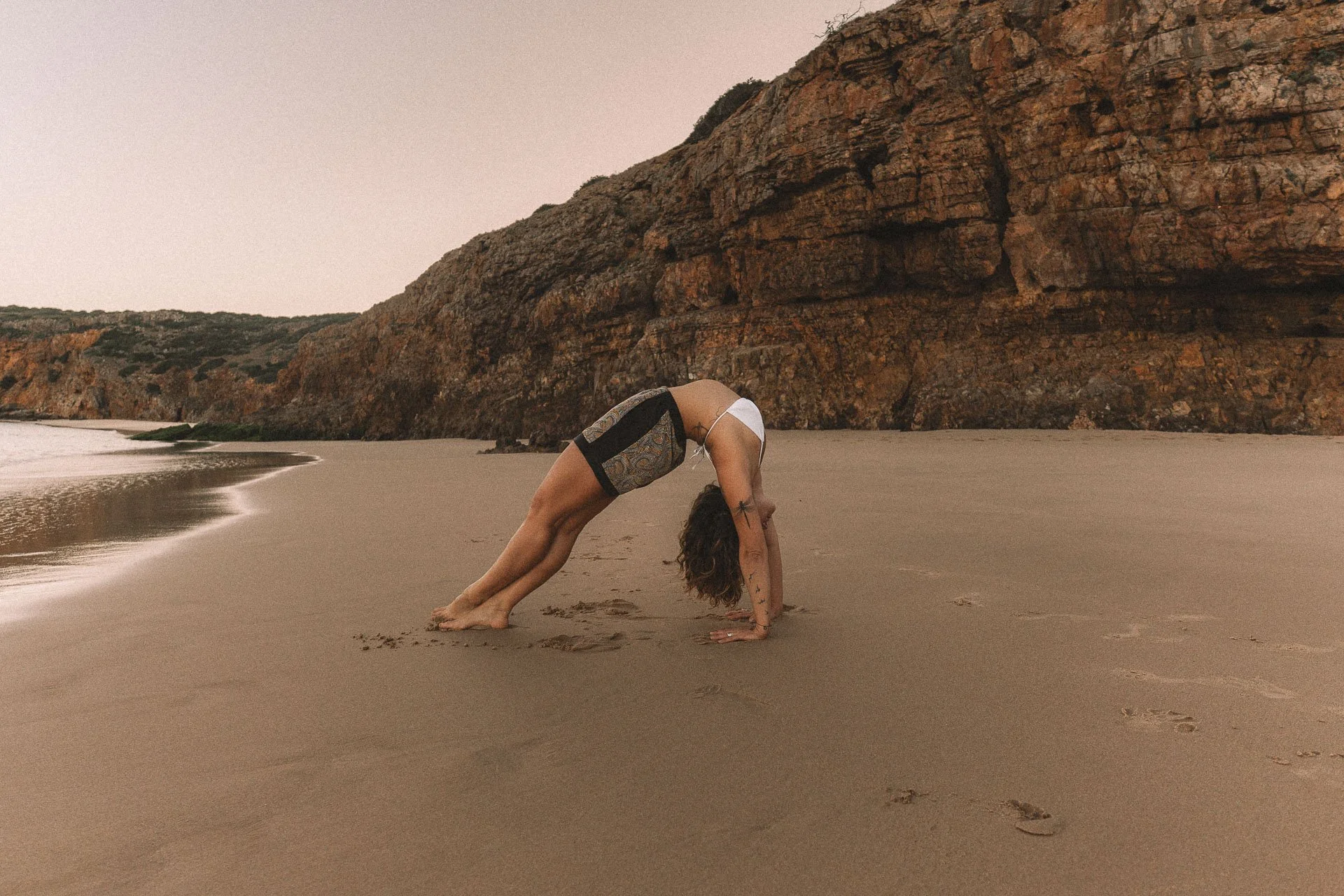 Yoga flow sequence photographed at sunset, highlighting movement and natural posture.
