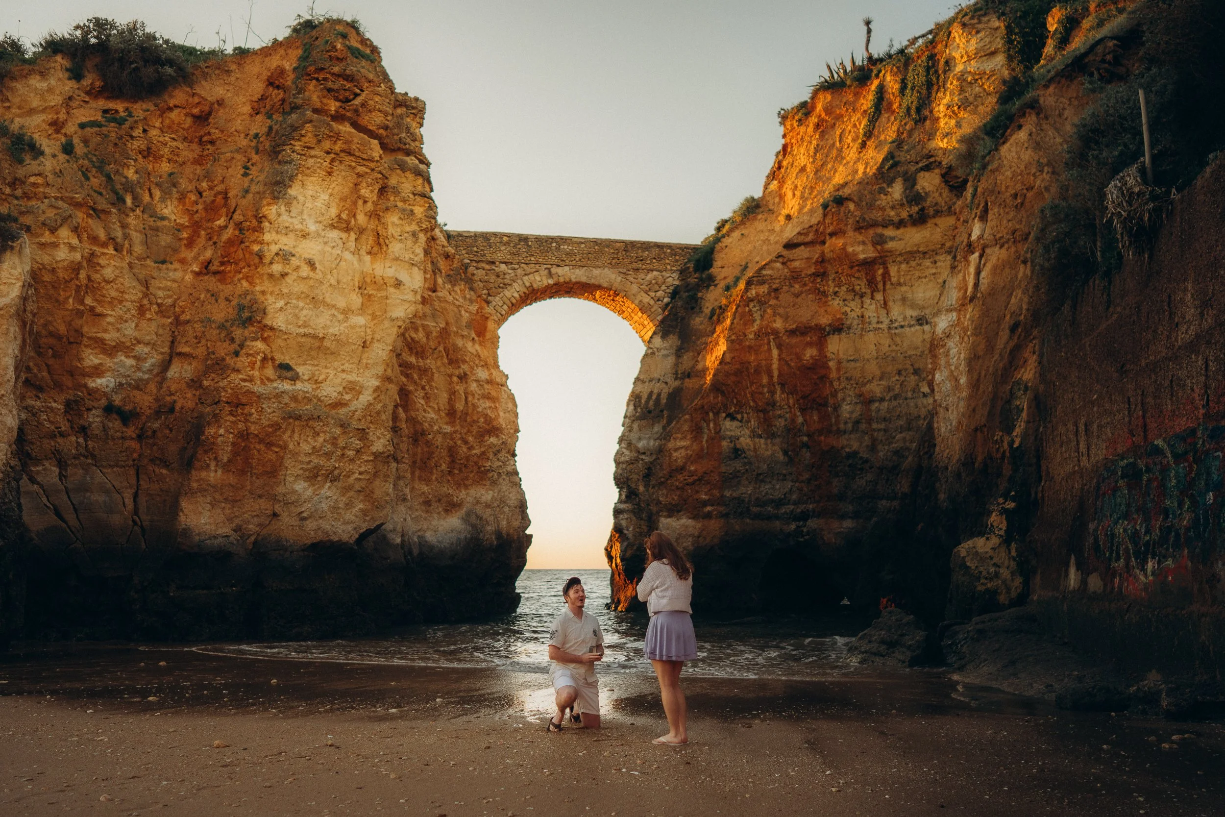 A surprise proposal at sunrise in Lagos, Praia dos estudiante. Algarve