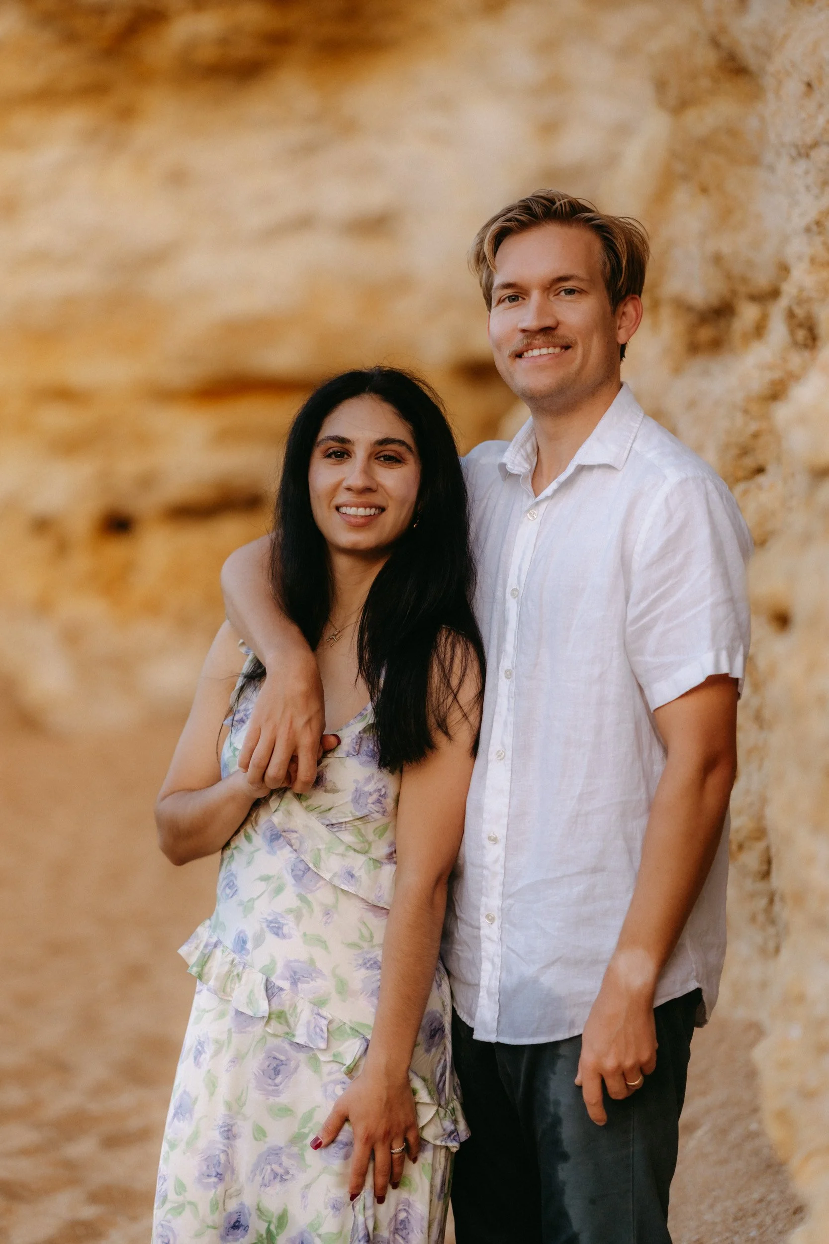 The textured limestone cliffs create a warm, natural backdrop.
Simple posing, relaxed expressions, and soft light make the image feel timeless and effortless.