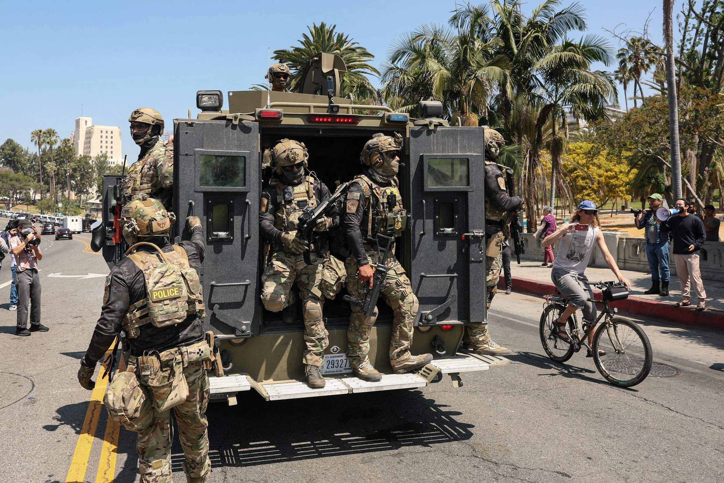 Masked ICE operatives in Los Angeles, July 2025. Photo © Mario Tama / Getty Images via Southern California Public Radio.