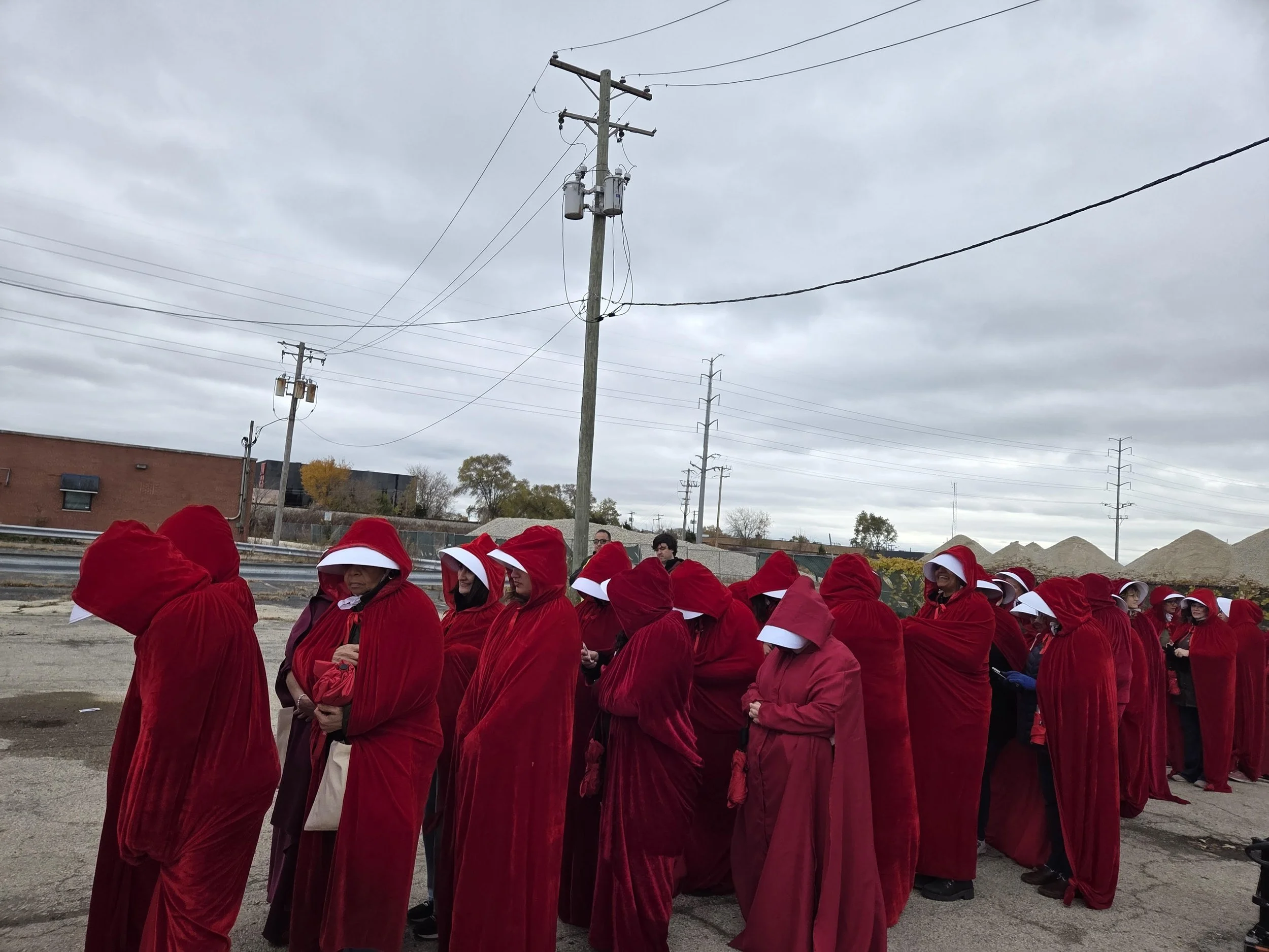 Women showing up to a rally inspired by Margaret Atwood’s novel