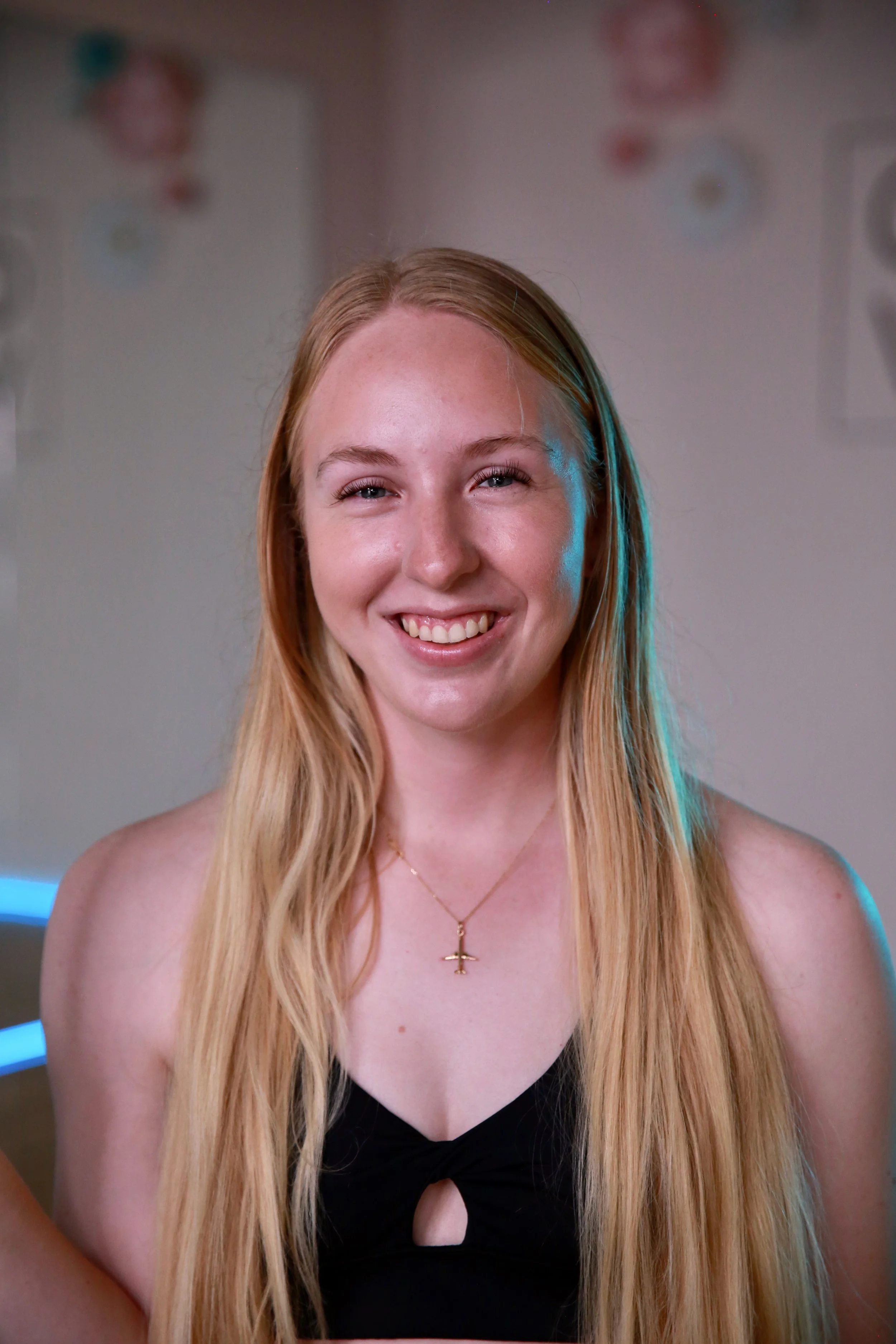 woman with long blonde hair smiling