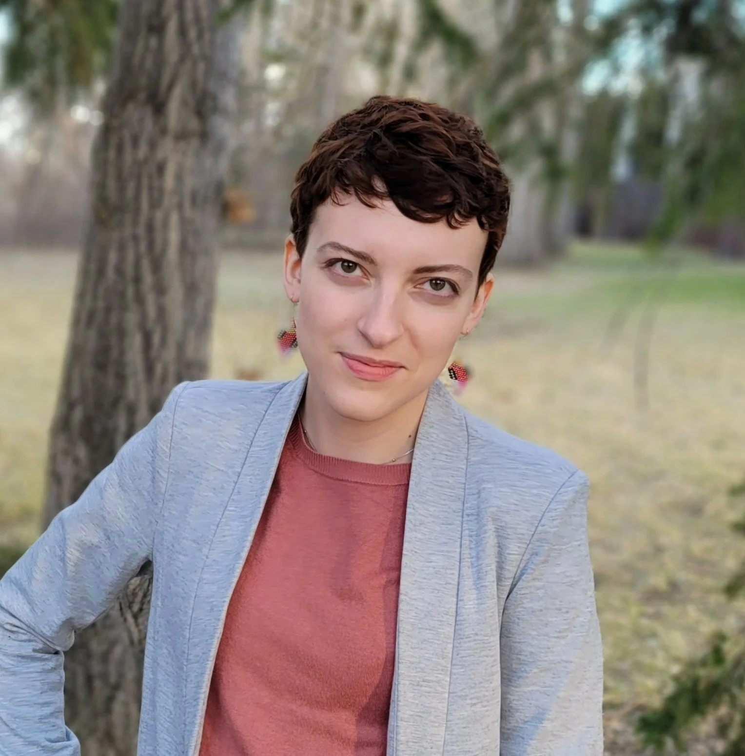 Professional head shot of Anastasiia Sheichuk in nature