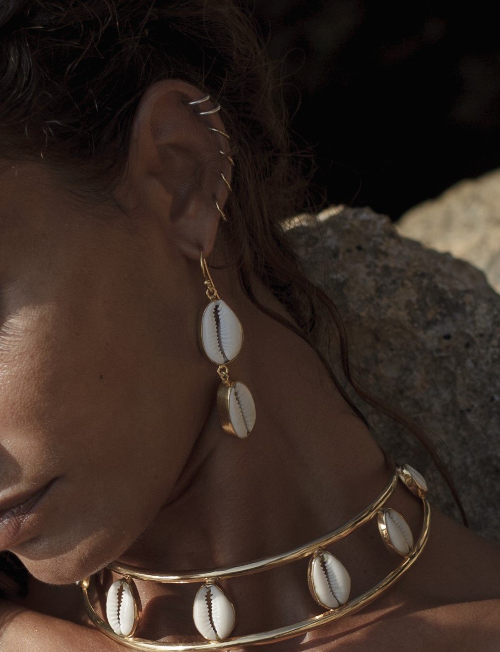 a handmade gold and cowrie shell necklce