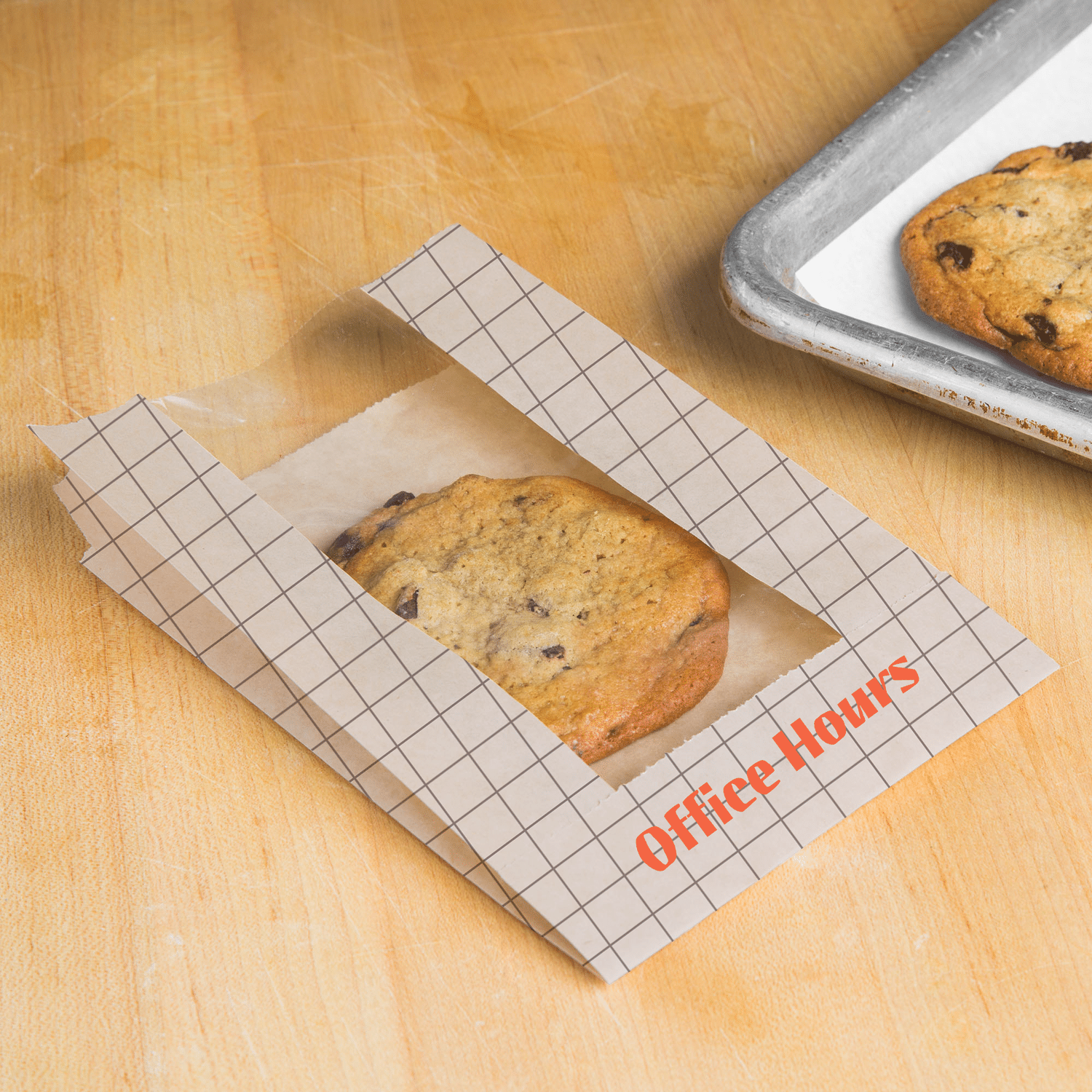 Freshly baked cookie in grid-patterned Office Hours packaging | The Morris Project