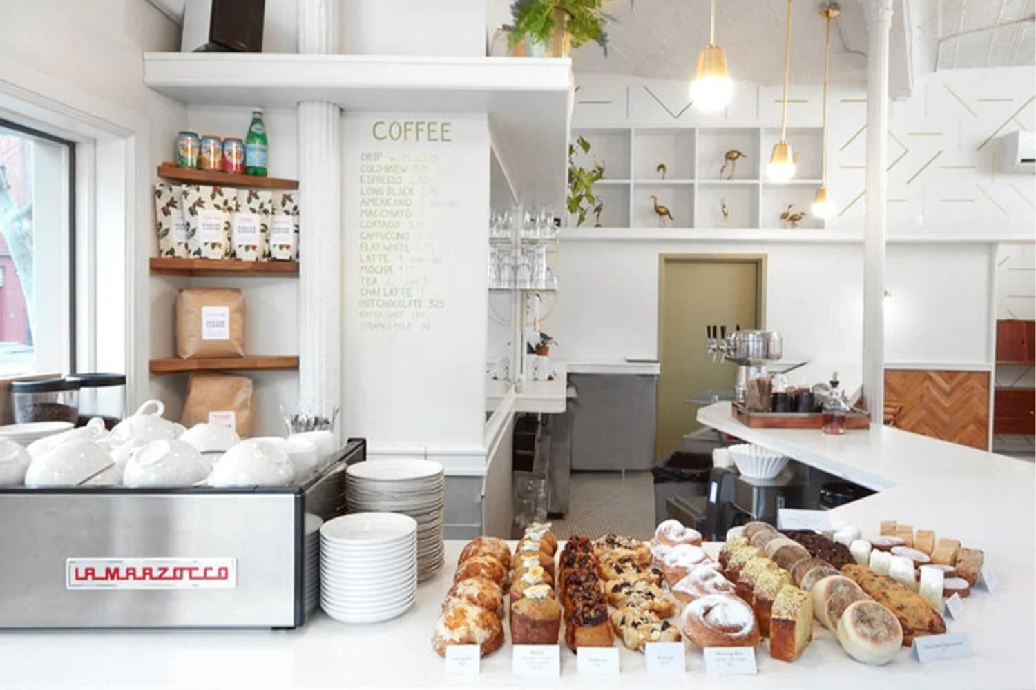 Coffee station with pastries, La Marzocco machine, and curated decor | The Morris Project