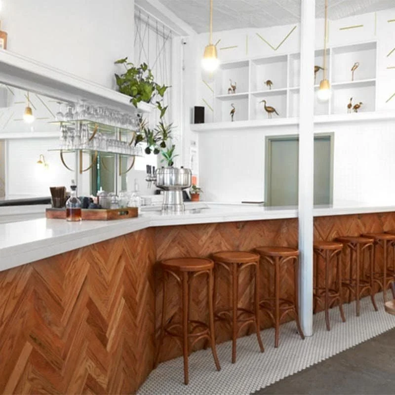 Textured bar with wood accents, marble counters, and curated decor details | The Morris Project
