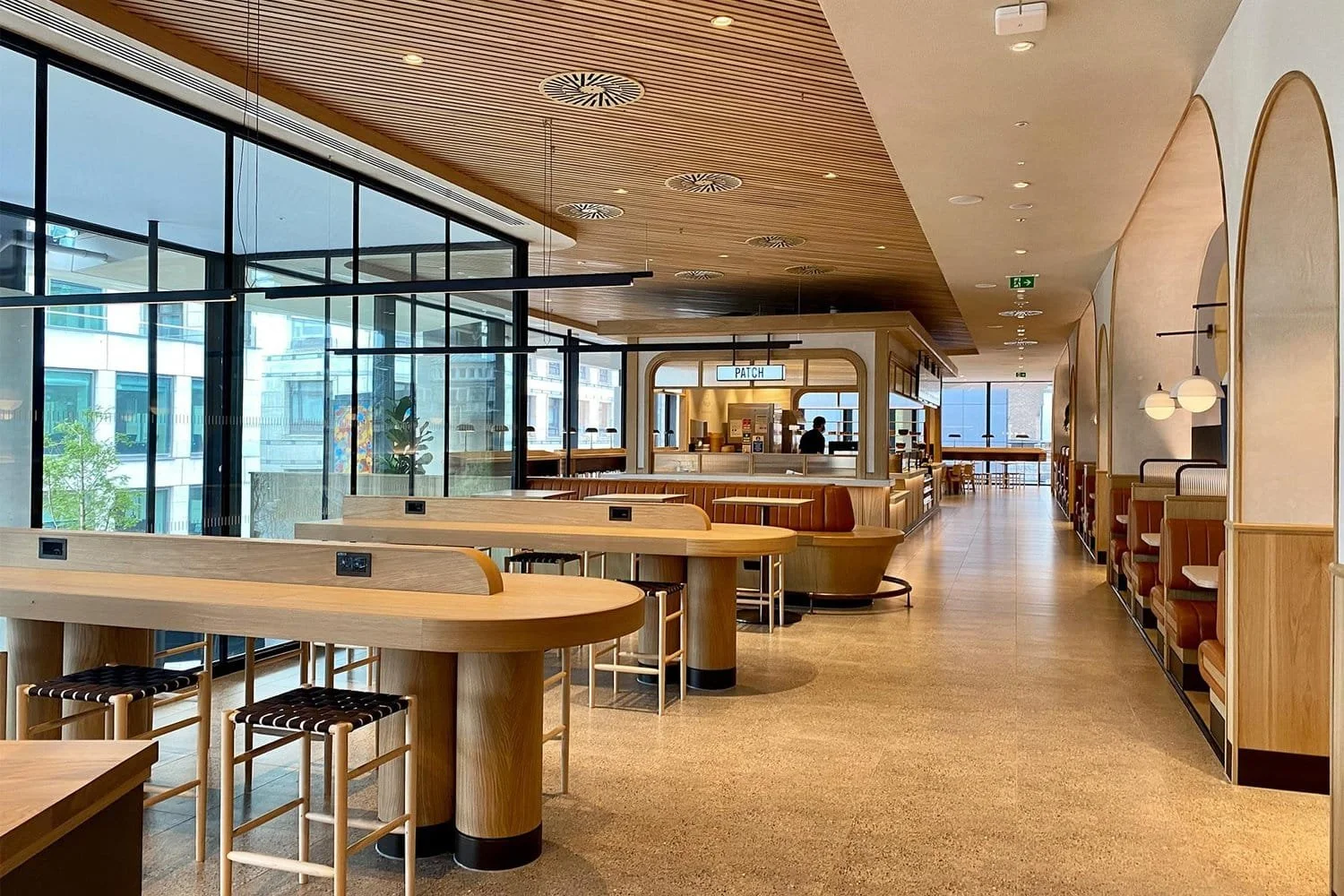 Warm and inviting coworking and dining area with modern wood accents | The Morris Project