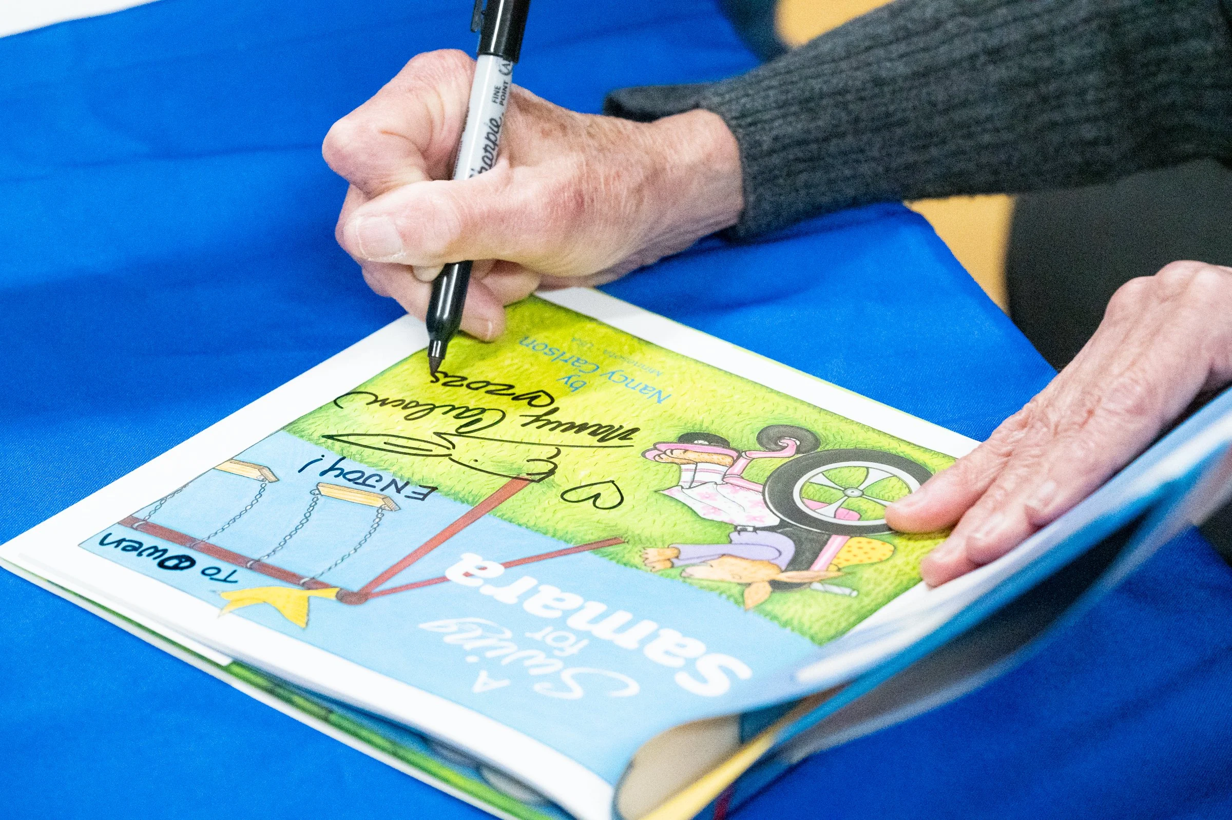“A Swing for Samara” book sale at the Hopkins Farmers Market