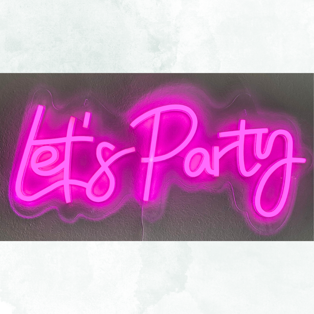 Pink neon sign that reads 'Let's Party'
