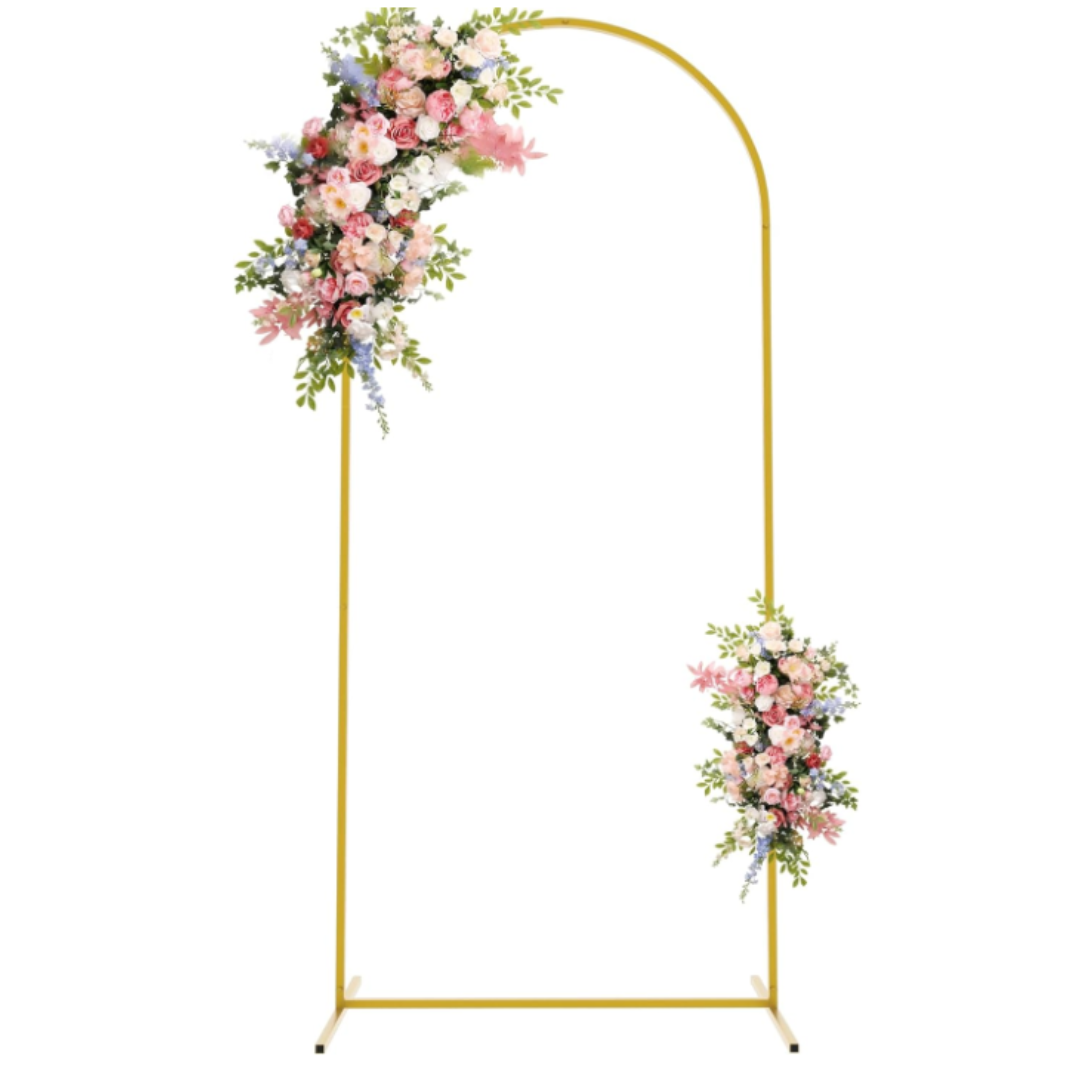 A floral wedding arch with a gold metal frame, decorated with pink, white, and purple flowers and green foliage.