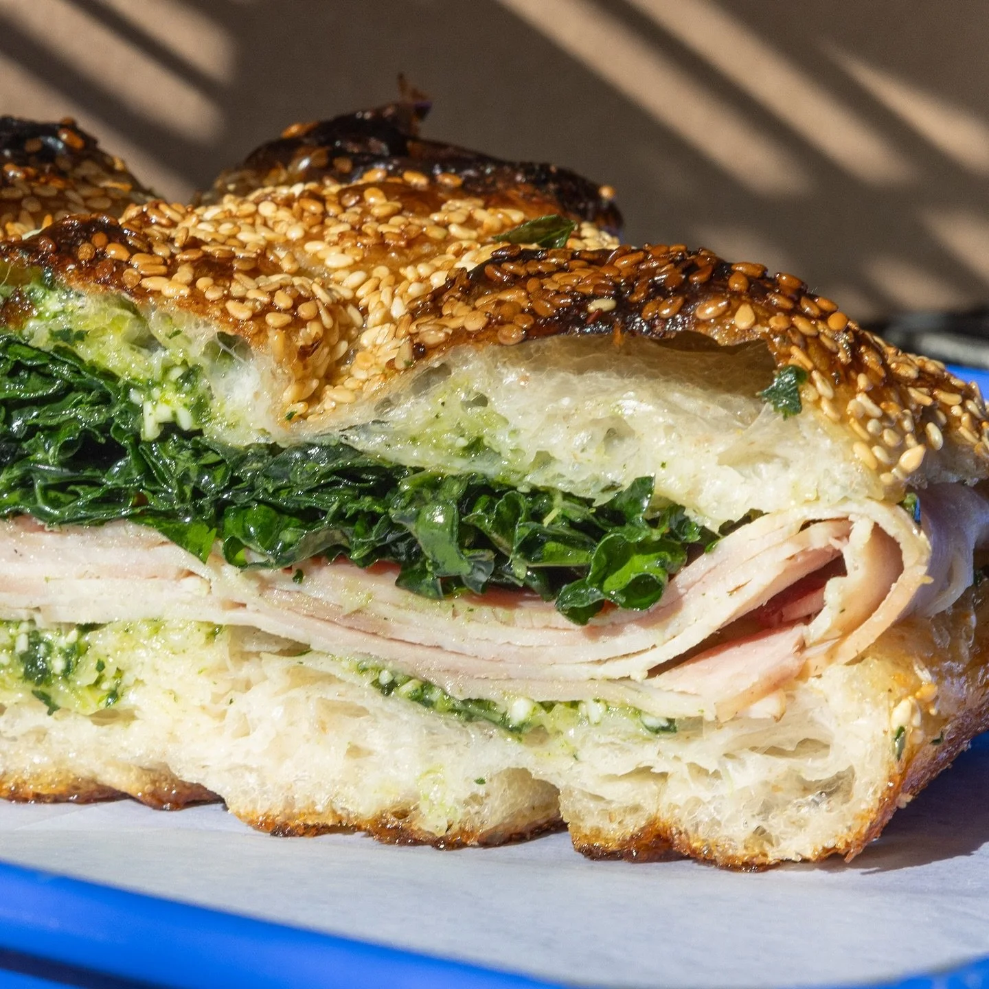 TURKEY, BASIL PESTO, MARINATED KALE

All piled on our sourdough sesame focaccia. 

Back, better than you remember. 

On the counter at both locations daily at 11am. 

📸 @alexstein