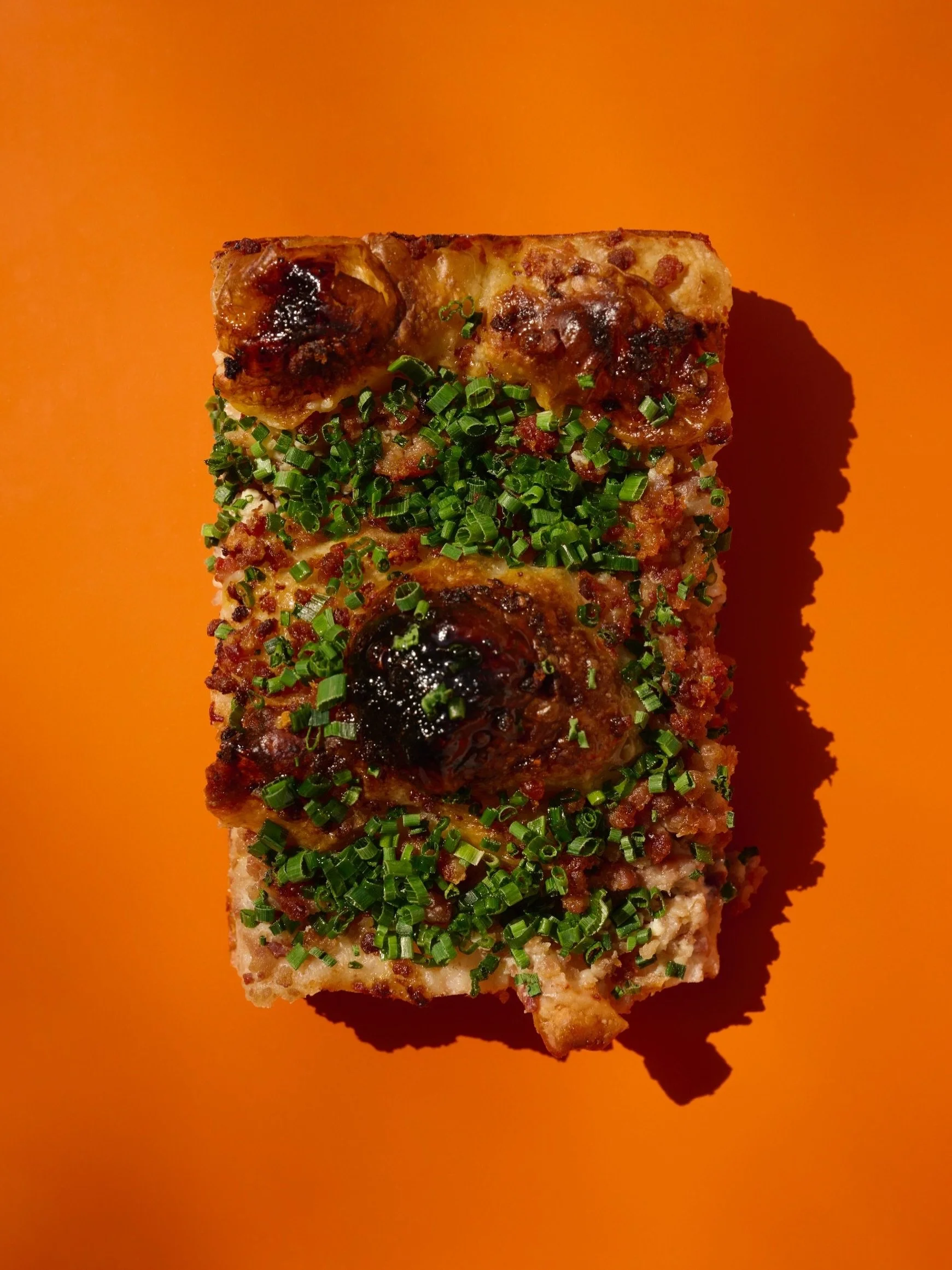 SAUSAGE &amp; CHIVE FOCACCIA

Custardy and tangy cr&egrave;me fraiche, meaty sausage, and that ffreeesssh onion hit of chives all come together for the perfect savory bite. 

An OG for a reason- back on the counter every day starting at 10am. 

Both 