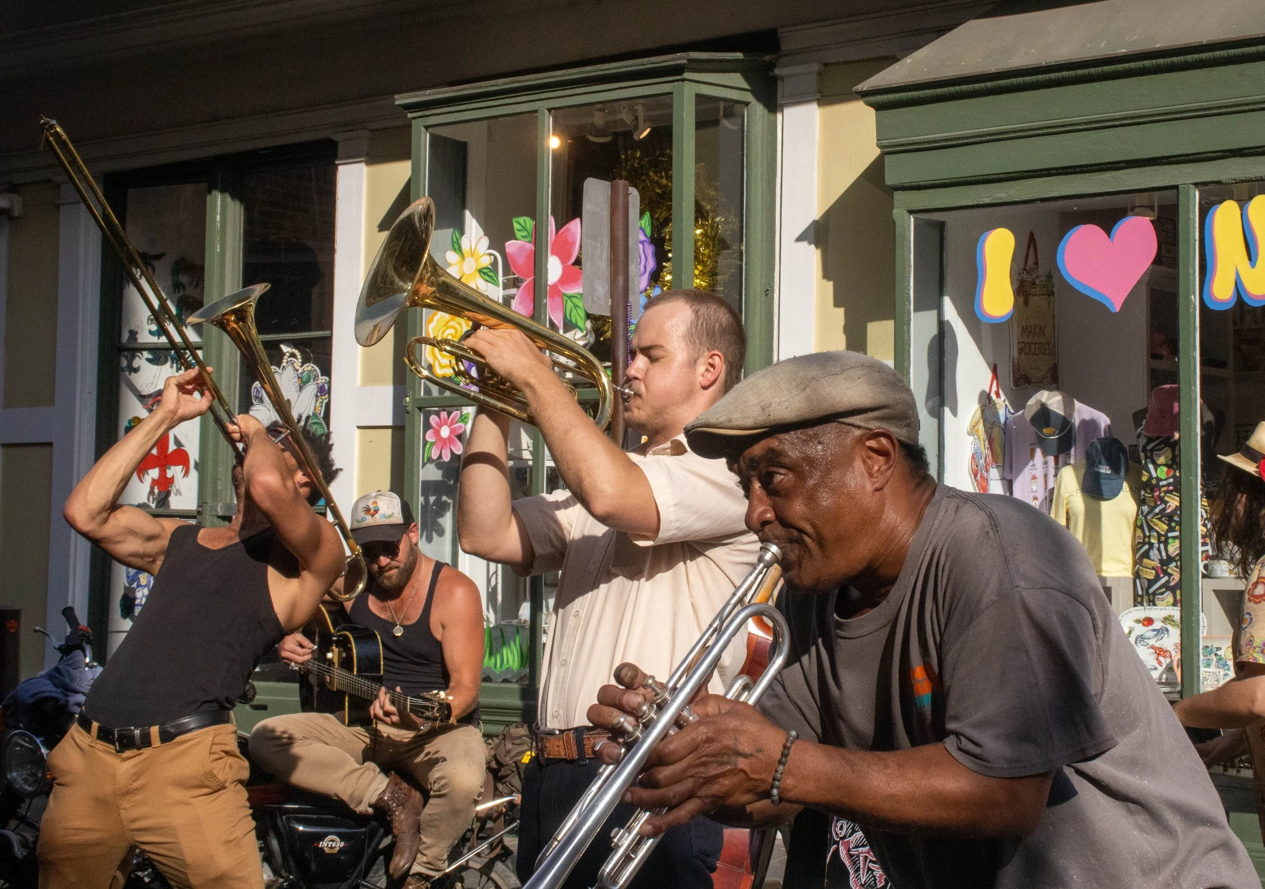 Reece Ashley, left, Benjamin Morren, middle, and Jimbo Lockhart, right, play the trombone and trumpet together on Royal Street in the French Quarter in New Orleans on Wednesday, April 1, 2026. They all are in The Dirty Rotten Viper Band, which freque