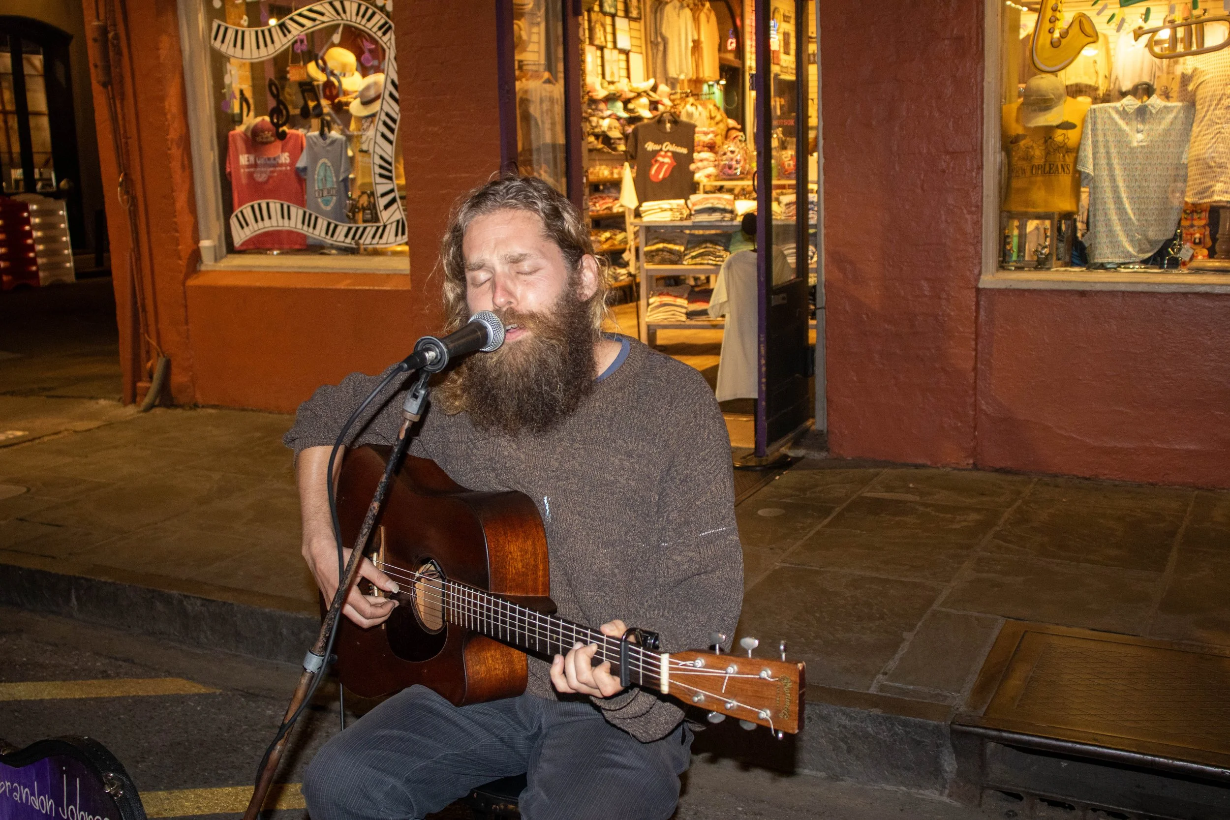 Brandon Johnas plays the acoustic guitar and sings on Royal Street in the French Quarter in New Orleans on Friday evening, April 10, 2026.