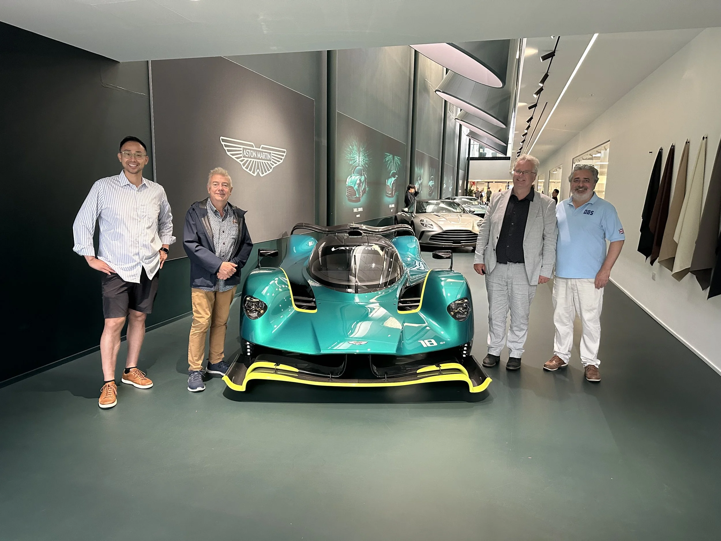 Motorsport Lab founder standing beside an Aston Martin during a private factory experience