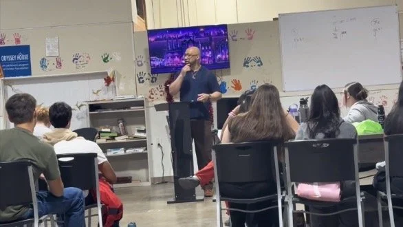 Shawn Robert Johnson speaking to youth and community members about resilience, personal growth, mentorship, leadership, and overcoming adversity through Saving Souls Synergy outreach programs.