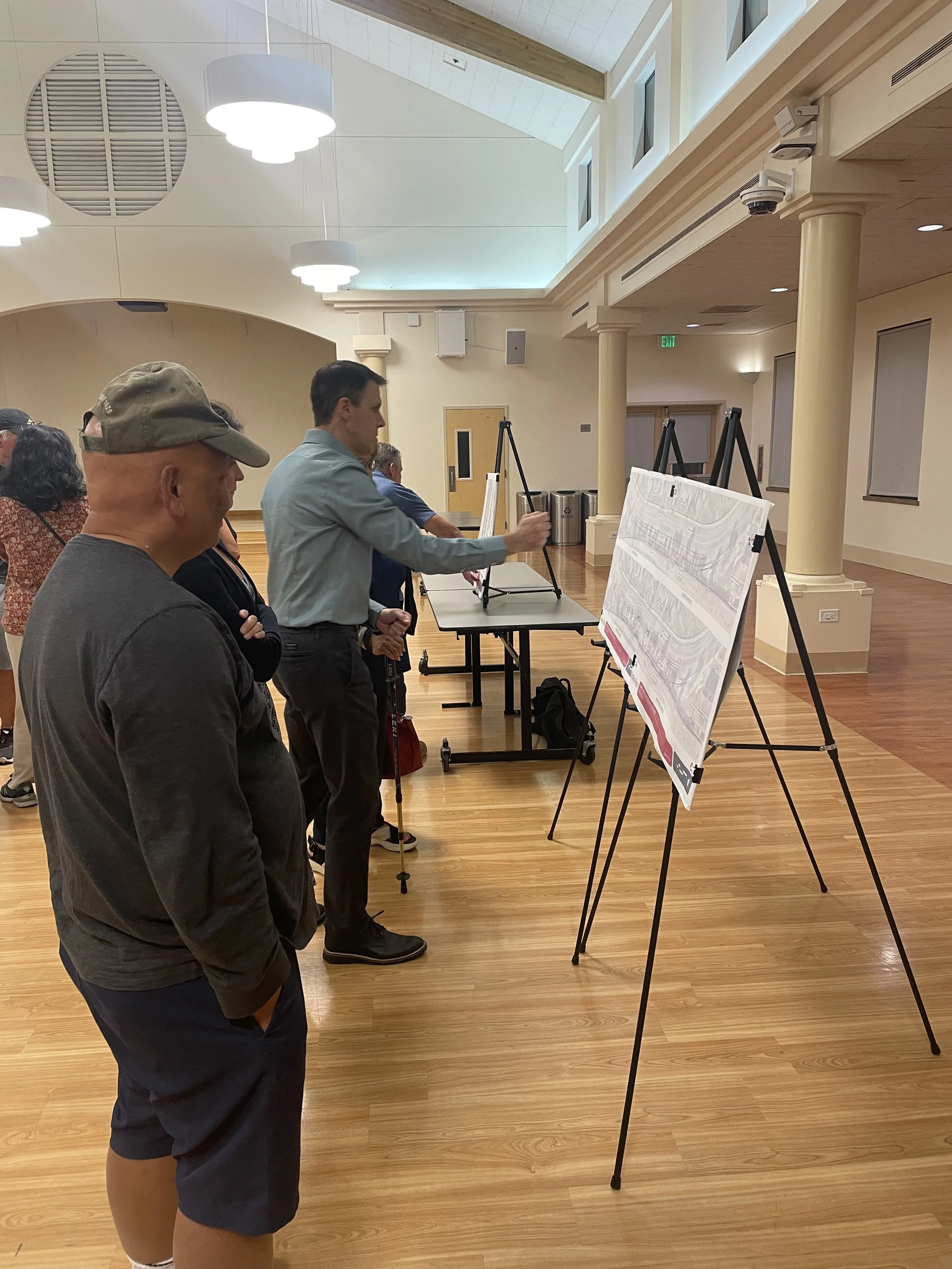 Local Community Members looking at stations during Open House