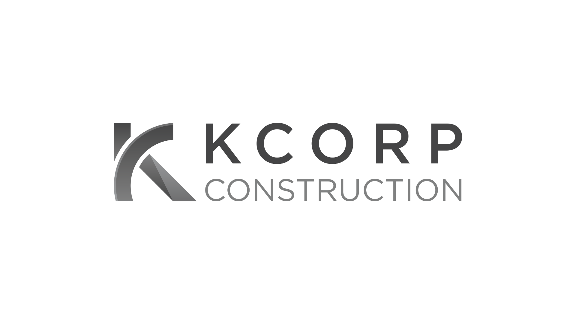 K Coorp Construction logo in black and gray text with abstract design