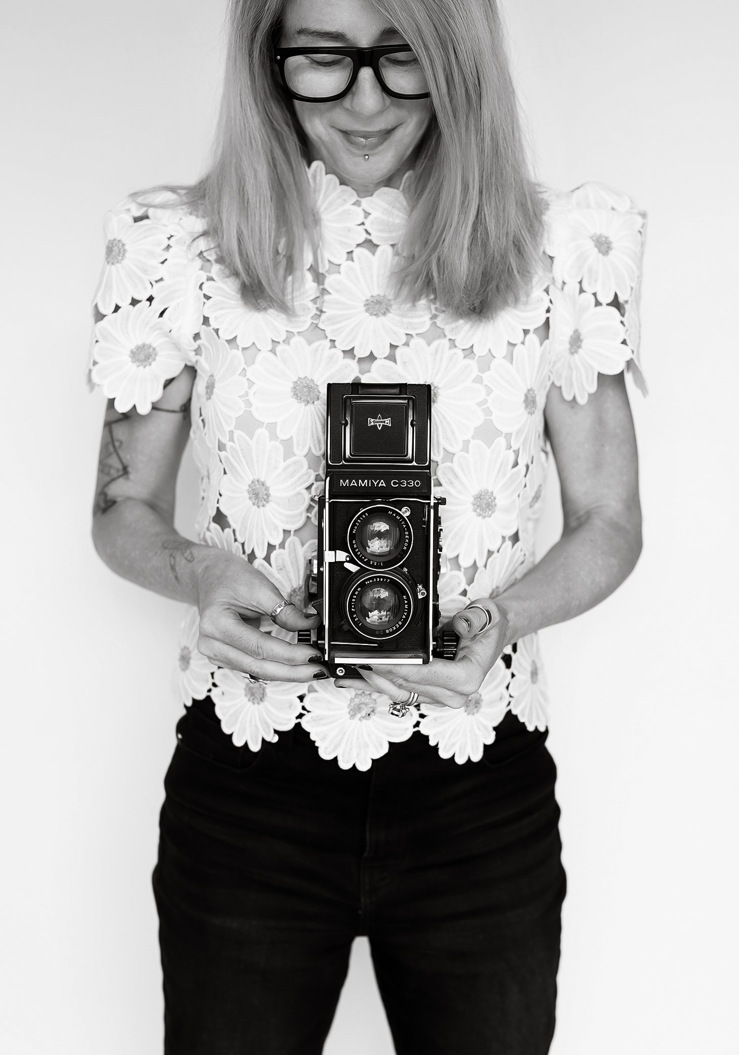 Adrienne in daisy top with Mamiya camera
