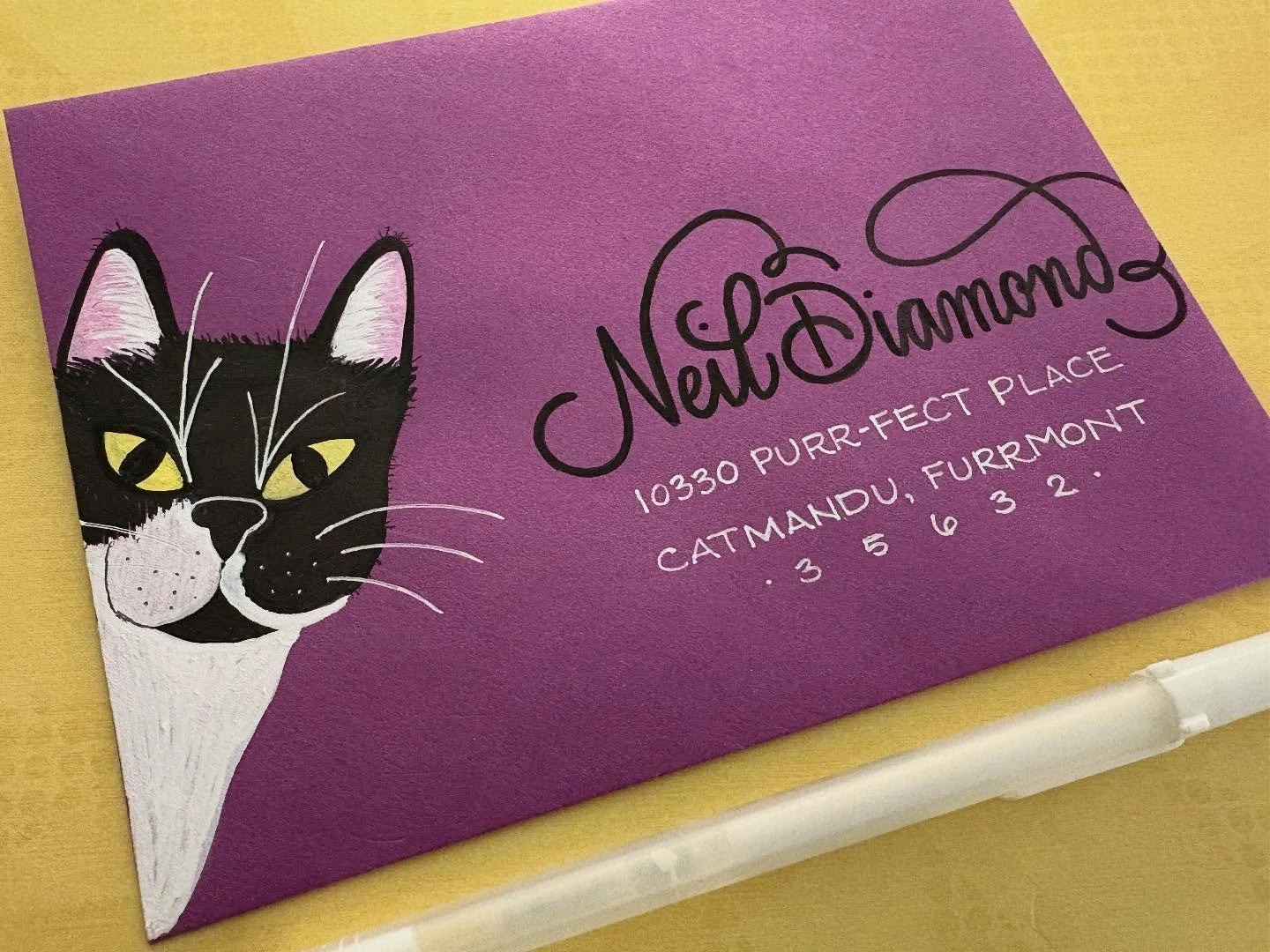 Day 27: Black Cat ๐‍โฌ 
Well now that we have our own tuxedo cat, I figured I had to draw Neil on an envelope. This little guy doesn’t look very scary, but I would definitely disagree as I had to clean up a plant he knocked off a shelf tod