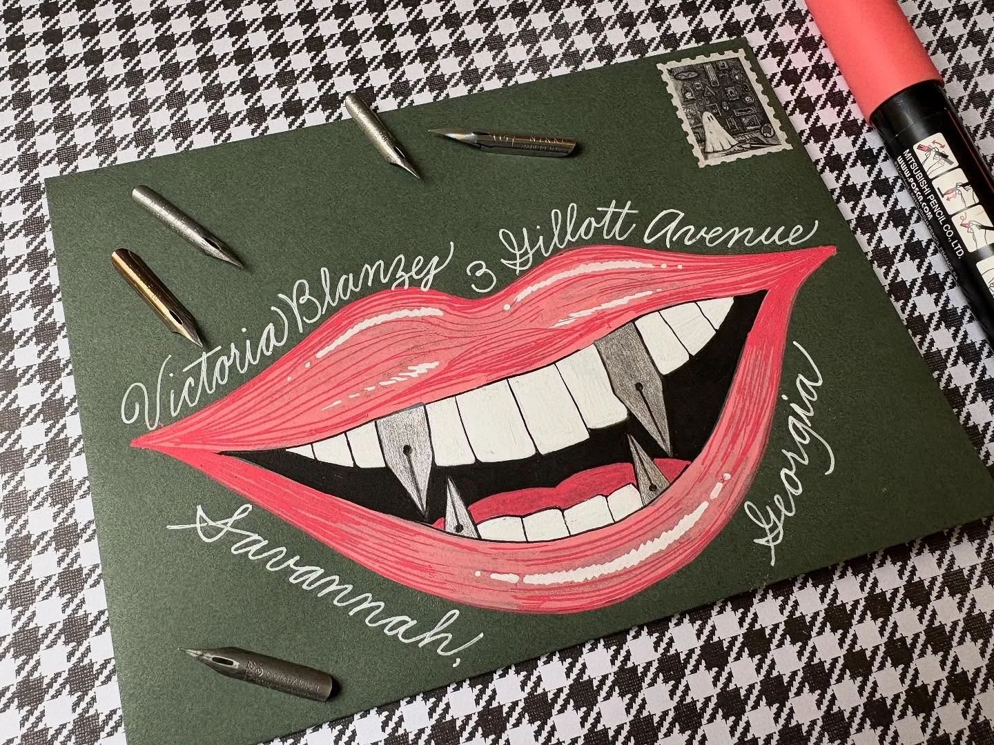 Day 29: Vampire 
Okay, this may be my weirdest envelope yet. I’m not a vampire book or movie person, so when I was looking up pictures of vampires for inspiration all I could see was the pointy teeth and think about them being calligraphy nibs