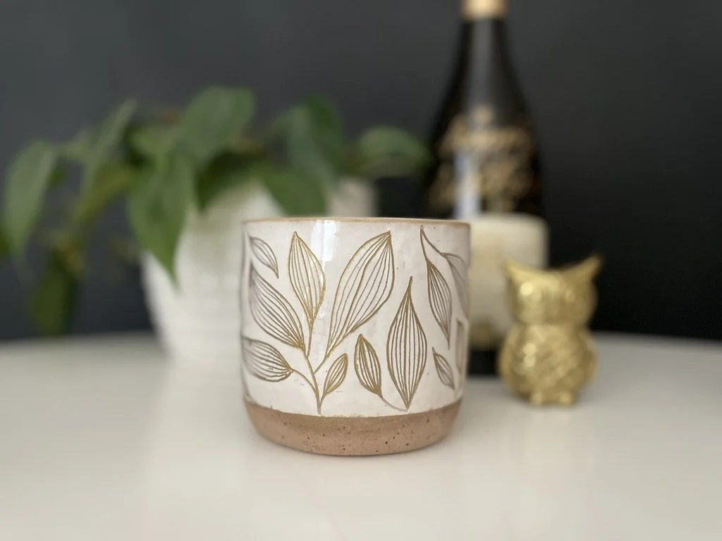 engraved pottery planter with leaf pattern