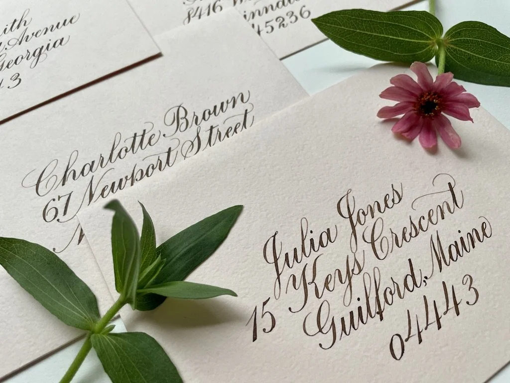 pale pink envelope with copperplate calligraphy