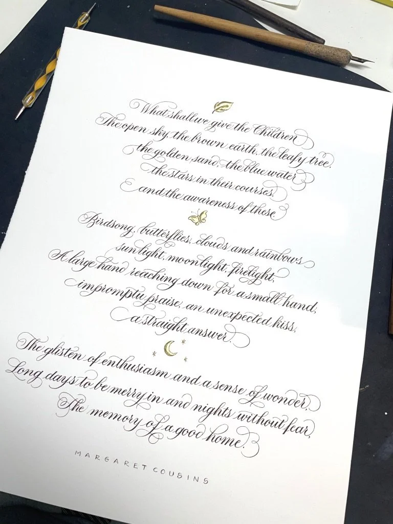 Copperplate calligraphy poem with gilded details