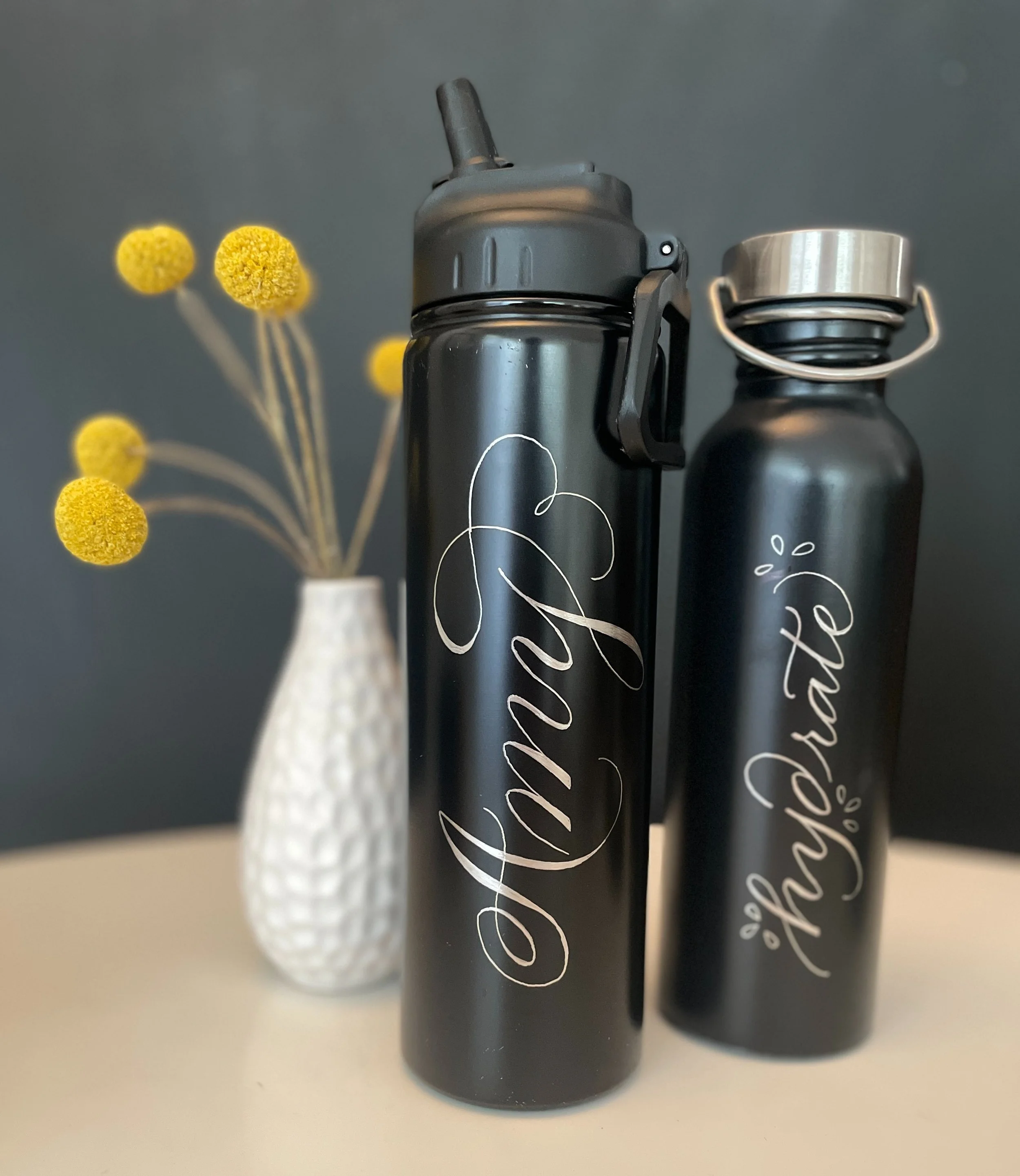 Engraved black steel waterbottles