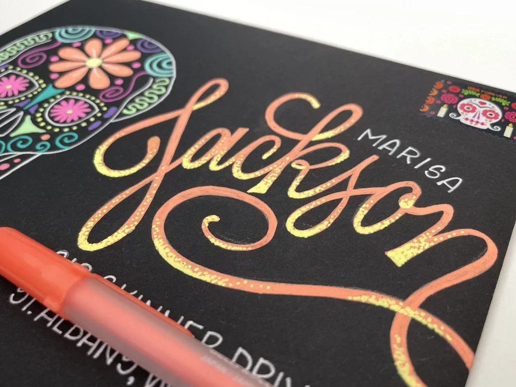 Day of the Dead calligraphy envelope design with gel pens