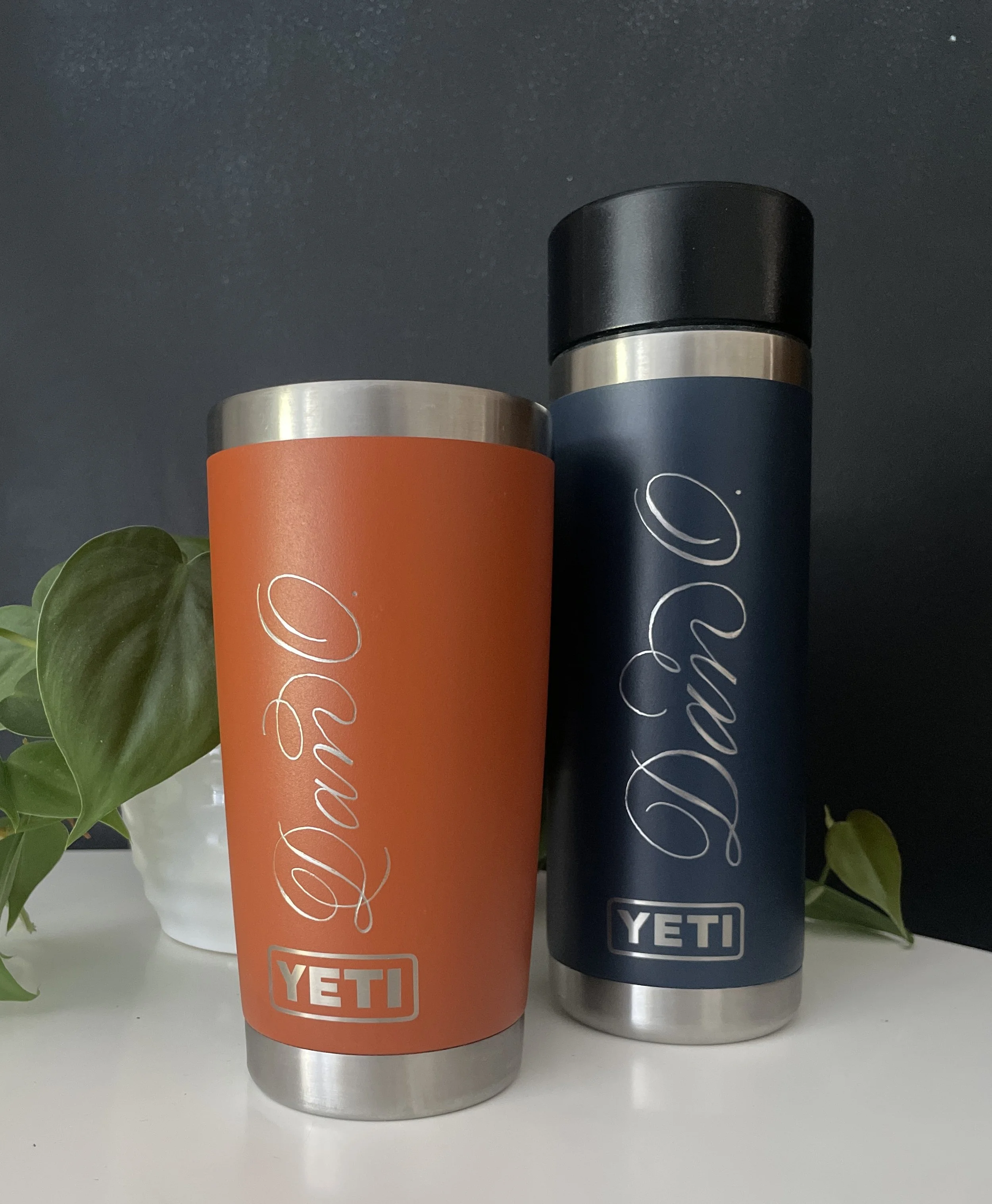 Engraved orange and navy insulated Yeti bottles 