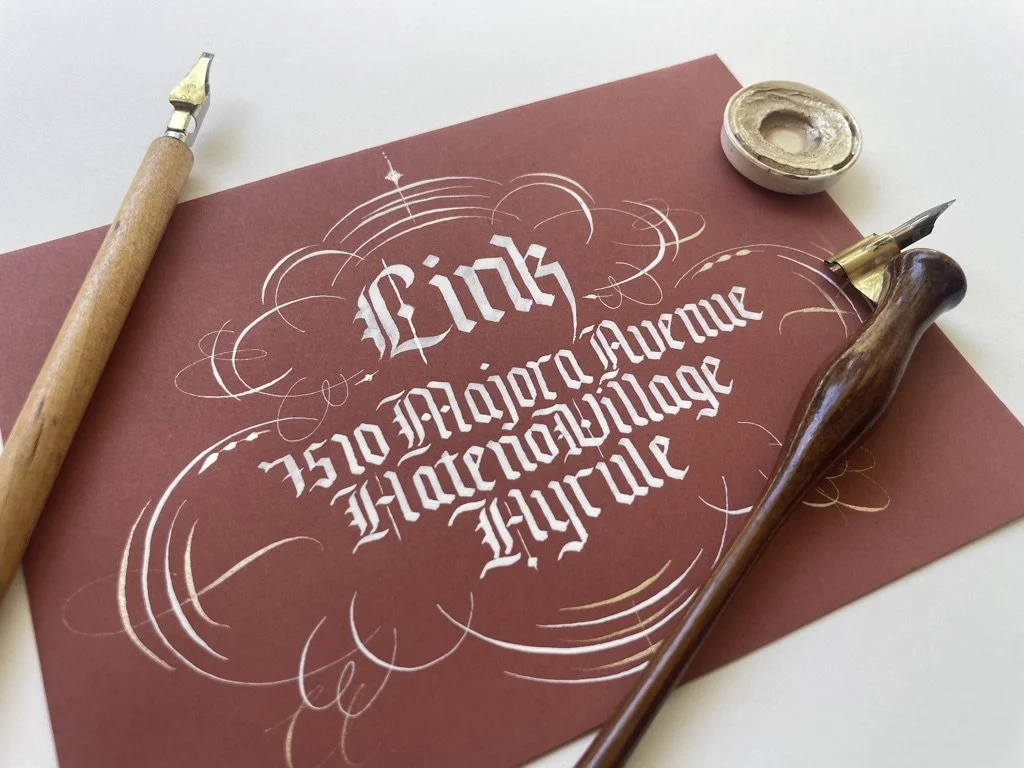 Gothic envelope design with title flourishing