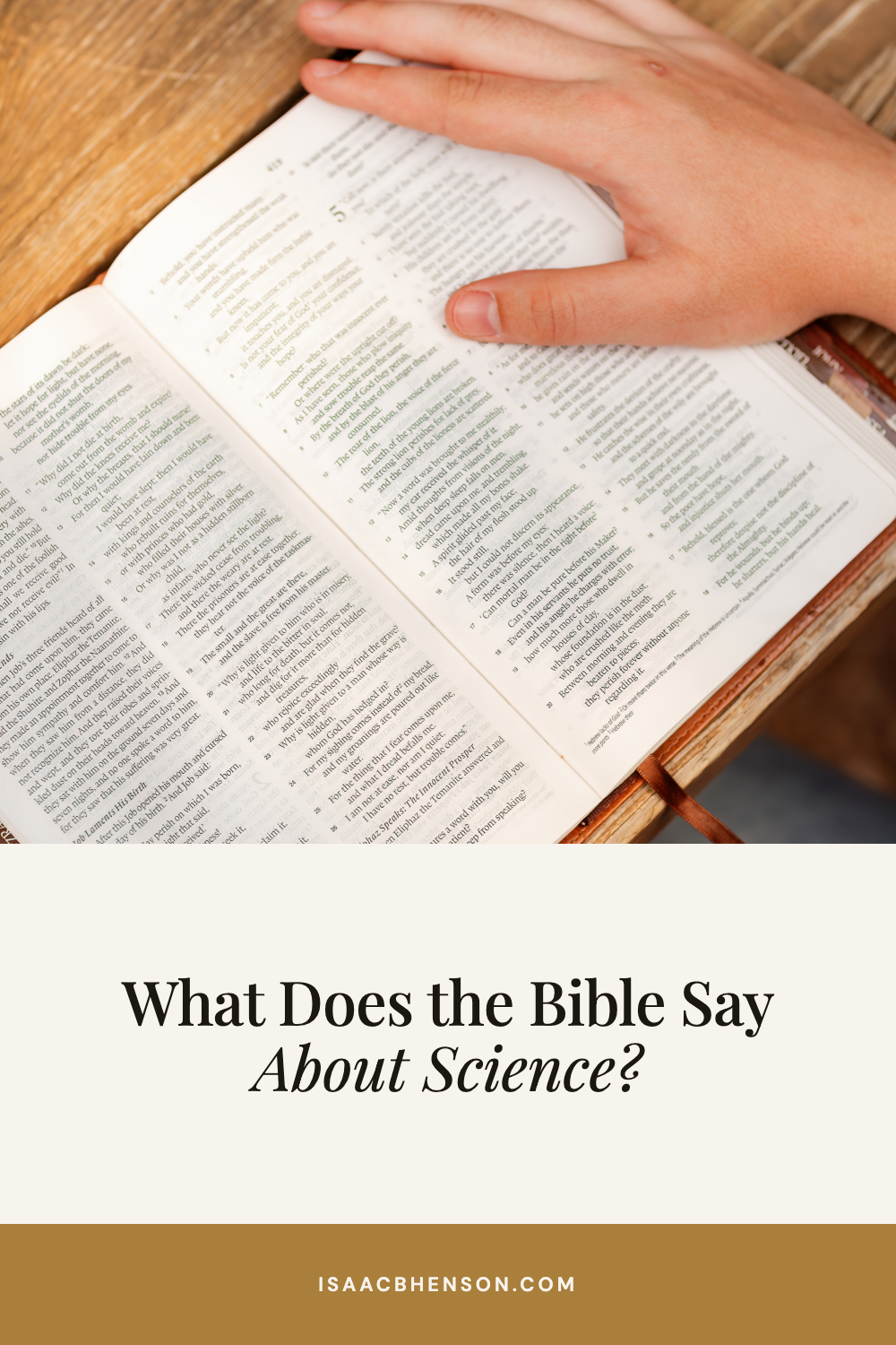What Does the Bible Say About Science? A hand rests on an open Bible.