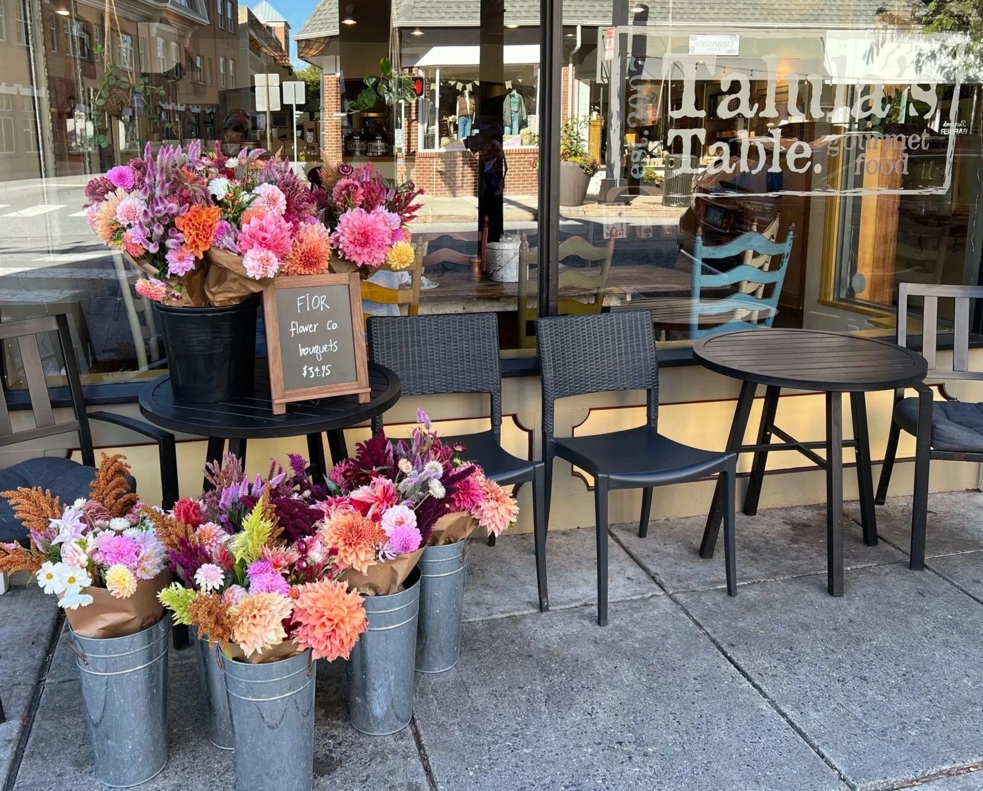Buckets of colorful dahlia flower bouquets outside Talula's Table in Kennett Square, PA 