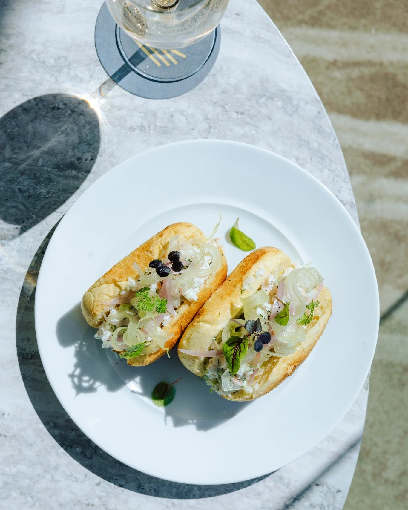 Made for beachside bites. 🌊🦐

Our Lemon &amp; Dill Prawn Roll - juicy marinated prawns, toasted brioche, pickled onion, baby cos, celery crunch &amp; fresh chives.