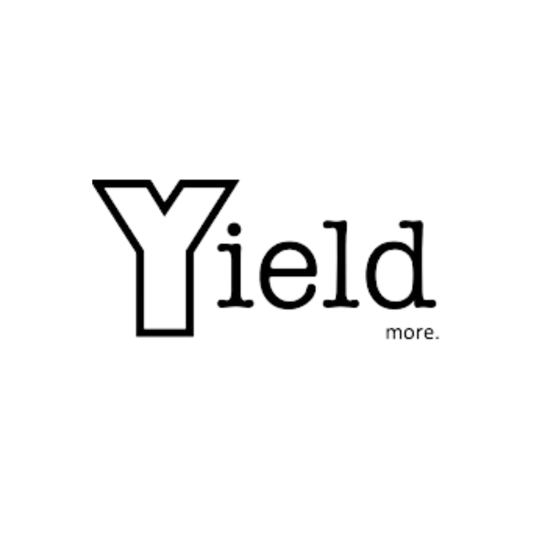 Close-up of the word 'Yied' with a stylized letter 'Y' designed to resemble a city skyline or building, with the small word 'more' beneath it.