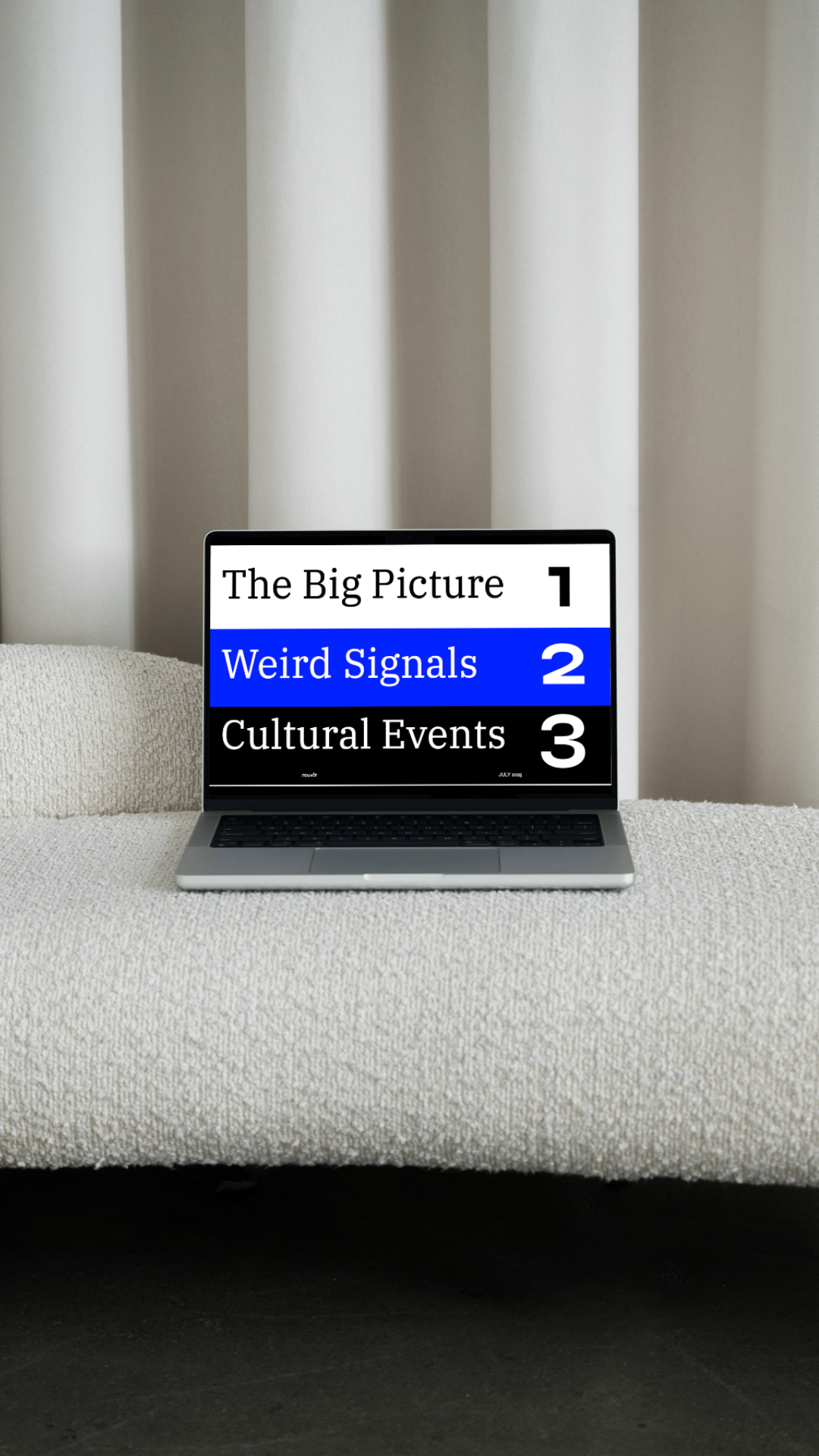 A laptop showing the nouvôt futures mindset for 2026 deck on display sits on a bouclé, white sofa in front of heavy cream curtains. The deck reads: 'The big picture, Weird Signals, and Cultural Events'