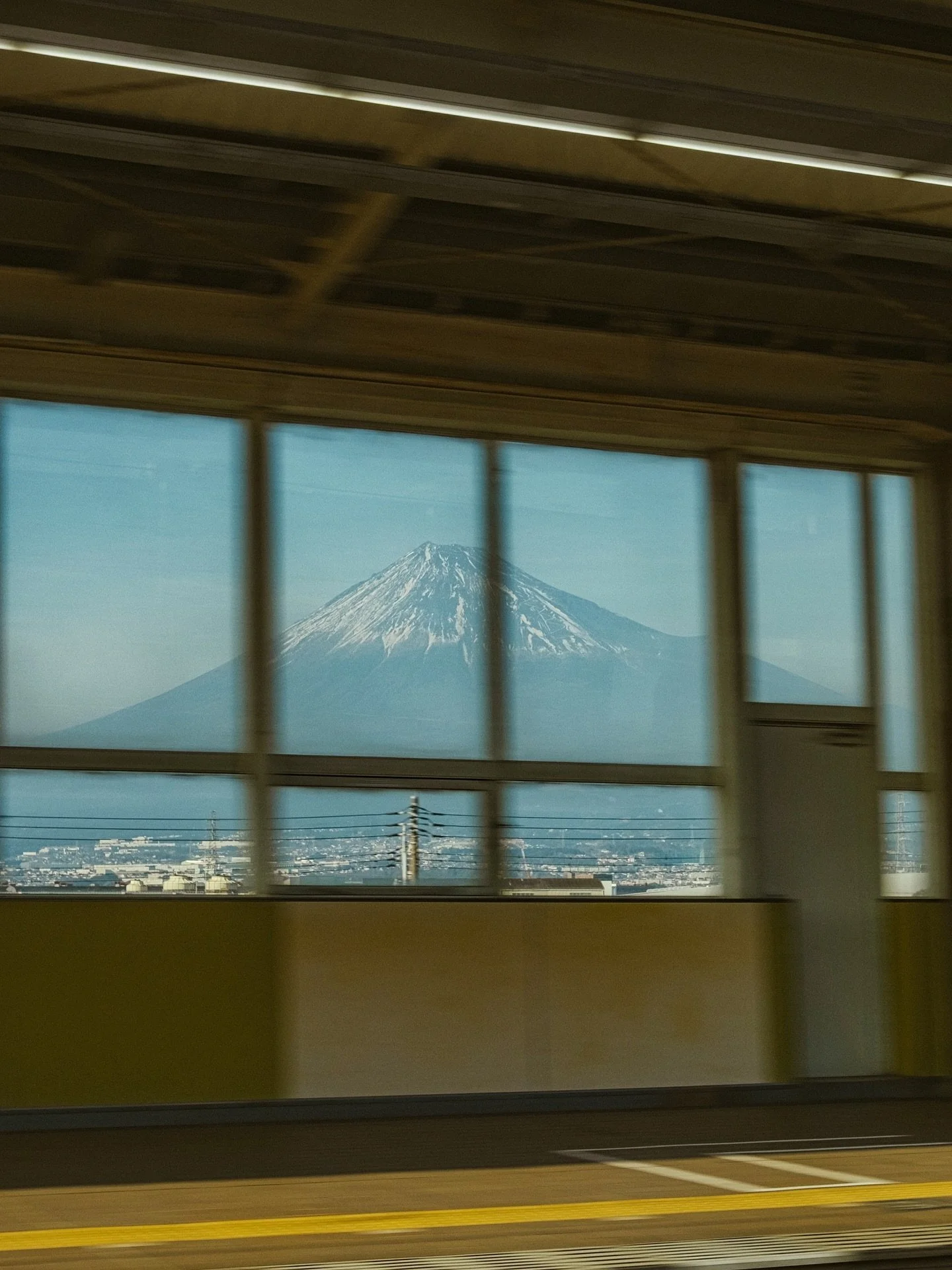 I used to put the camera away on travel days. Leaving Kyoto, I kept it out.
The city slid by in pieces: platforms, taxis, Fuji-san. The windows turned into frames.
Being on the road is a mix I&rsquo;m learning to enjoy, with excitement for what&rsquo