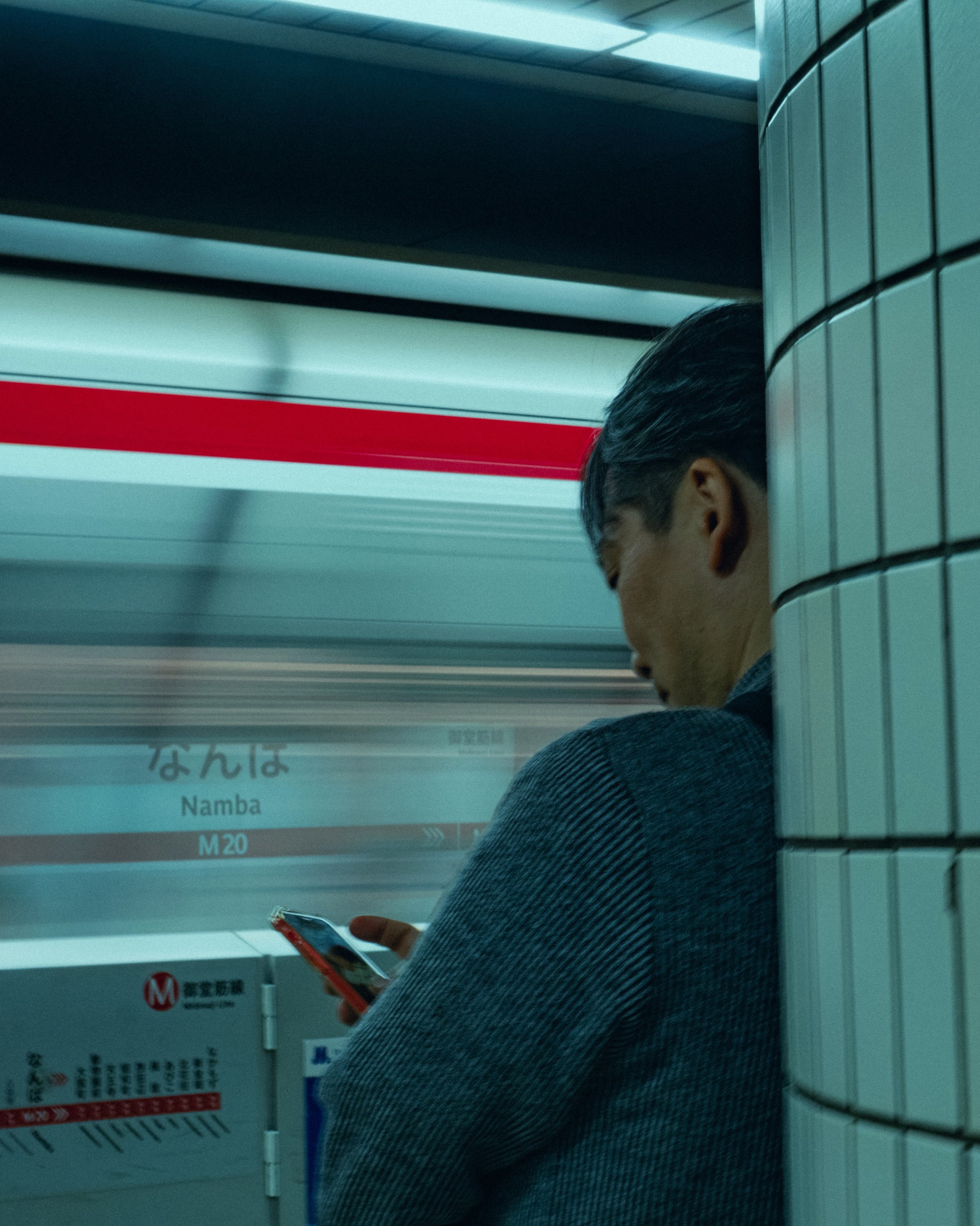 Nobody on the Osaka Metro is doing anything. Reading, staring at their phones, waiting to reach wherever they&rsquo;re going, watching a train blur past. It&rsquo;s the time of day when nothing is asked of you.

📍 Osaka, Japan, May 2026
📸 Fujifilm 