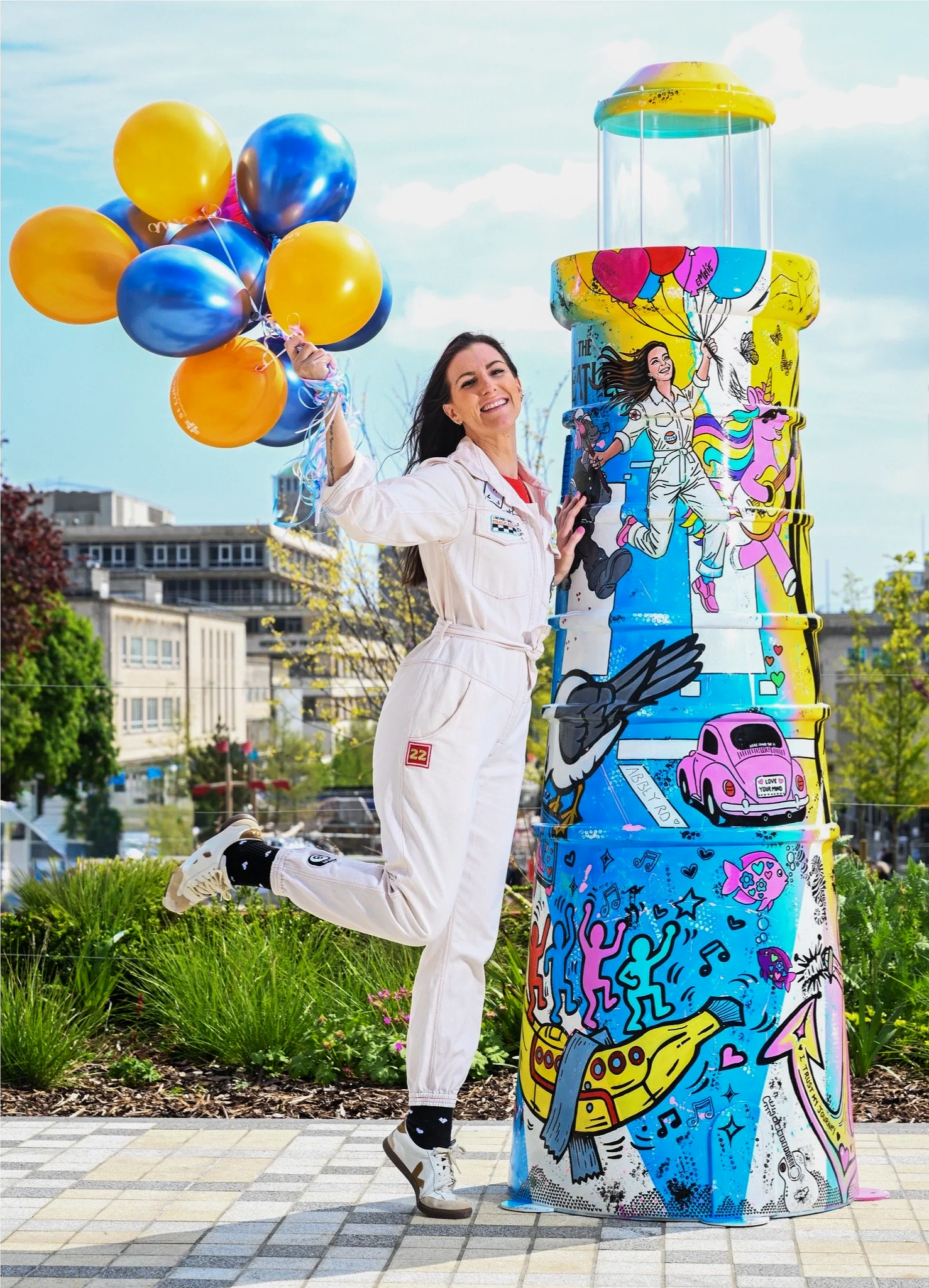 "The Beautiful Mind Artist" Emelie Susie showing her artwork for the lighthouse designed for the Guiding Lights sculpture trail around Plymouth.