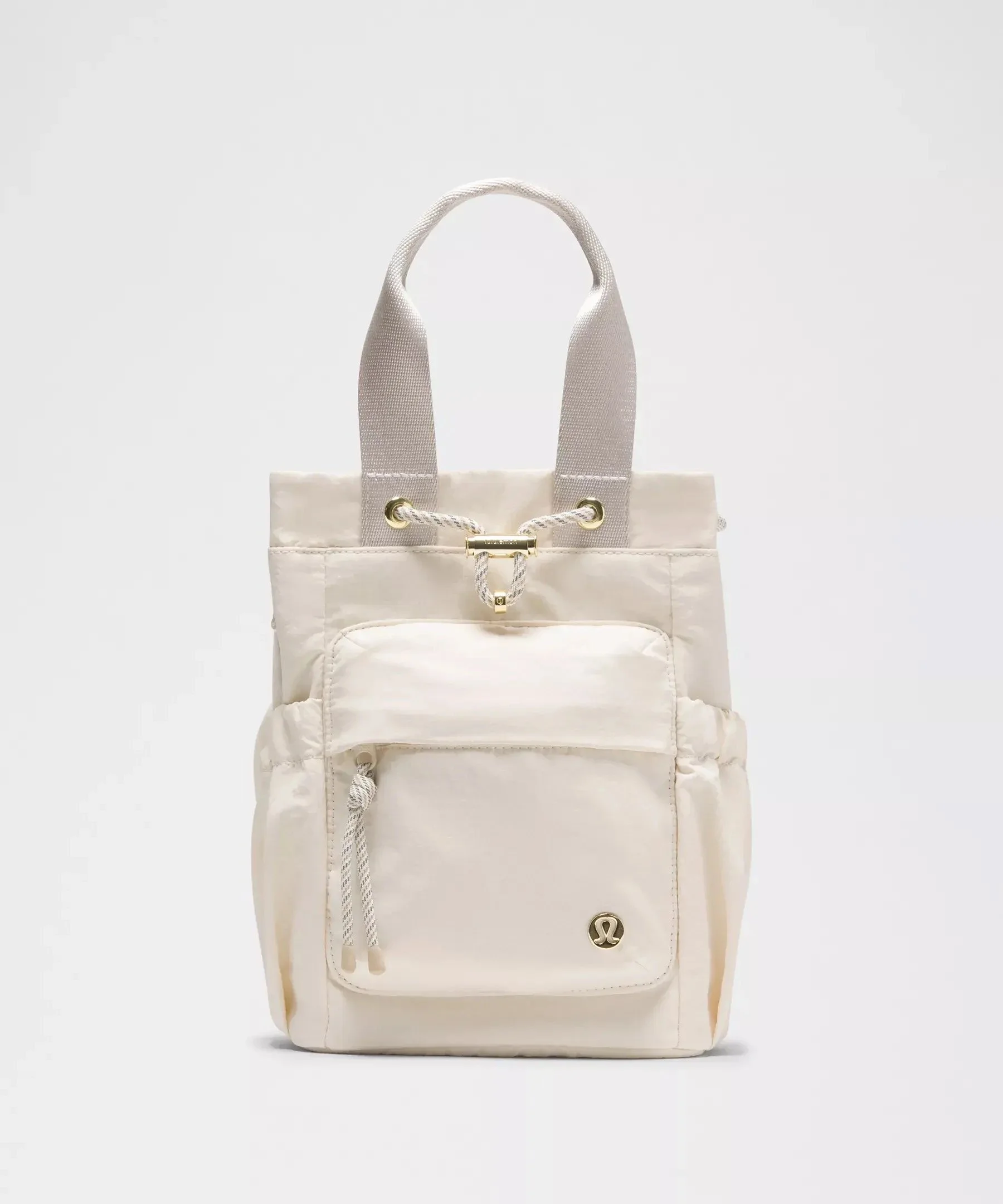 lululemon Convertible Drawstring Bucket Bag Mini 5L in Light Ivory/Wacky Khaki/Gold