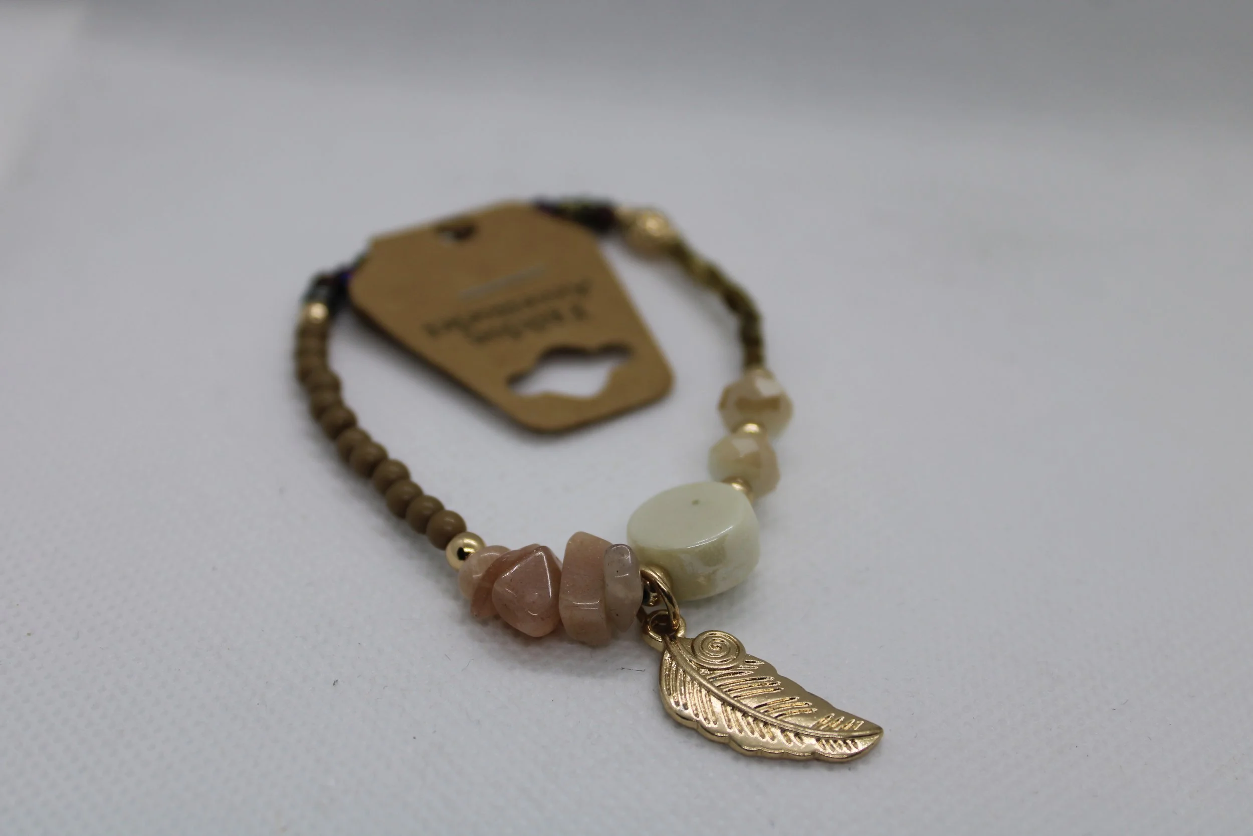 Pink, White, & Gold Beaded Bracelet With Feather Accent